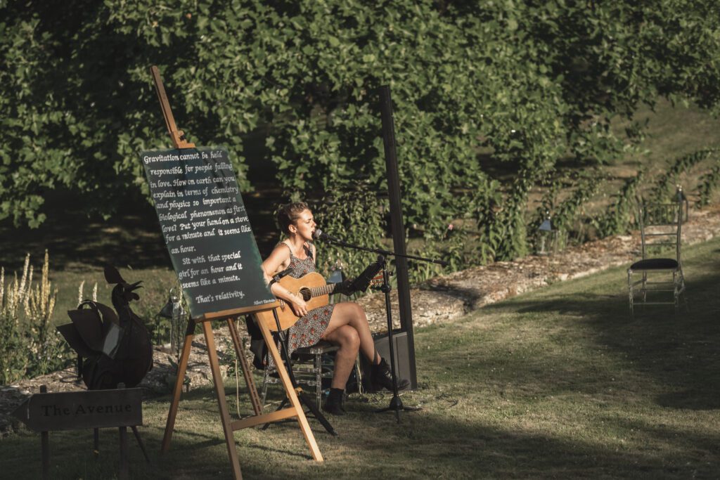 Singer and guitarist at Cotswolds summer outdoor wedding