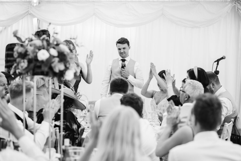 Documentary wedding photography capturing candid moments during wedding speeches