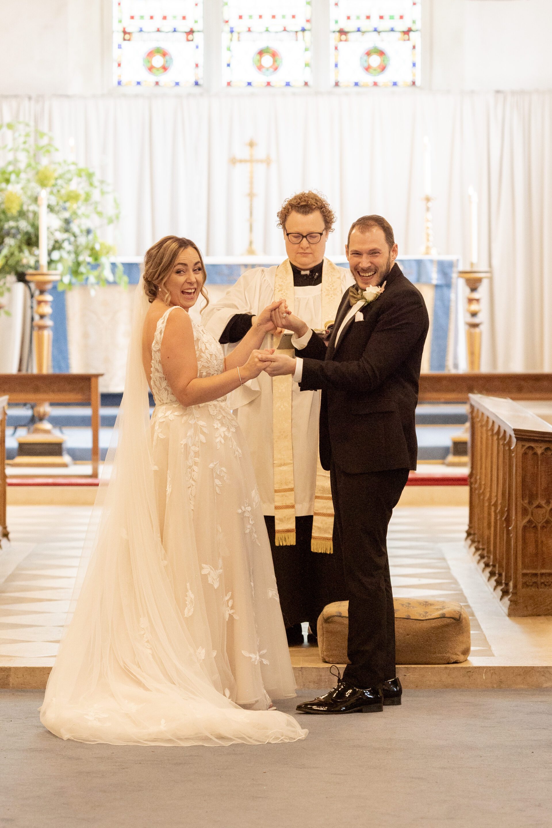 The bride and groom celebrate during their church wedding