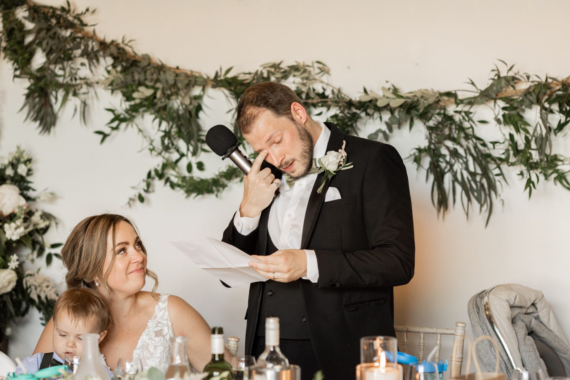 The groom sheds a tear during his speech at Old Luxters Barn wedding venue in Oxfordshire