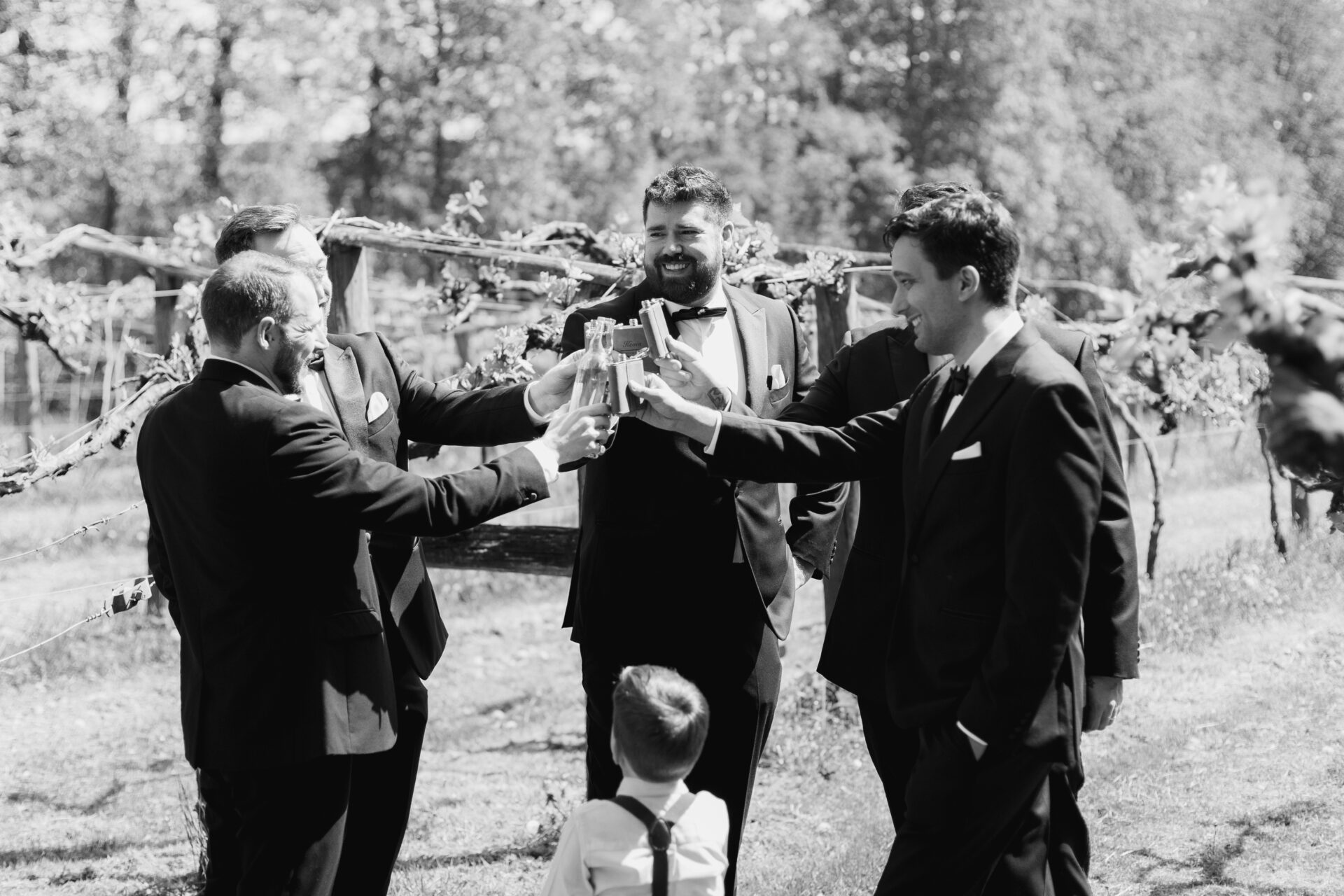 The groomsmen share a drink before the wedding ceremony