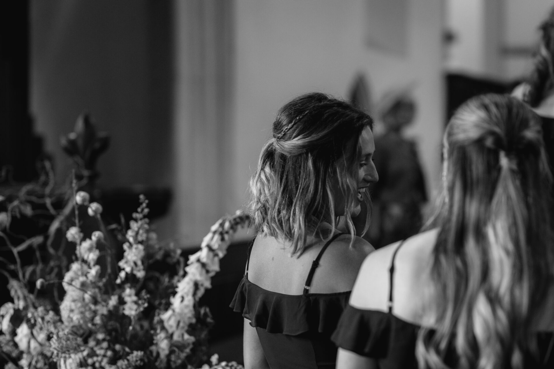 The bridesmaids share a laugh during the Devon church wedding ceremony