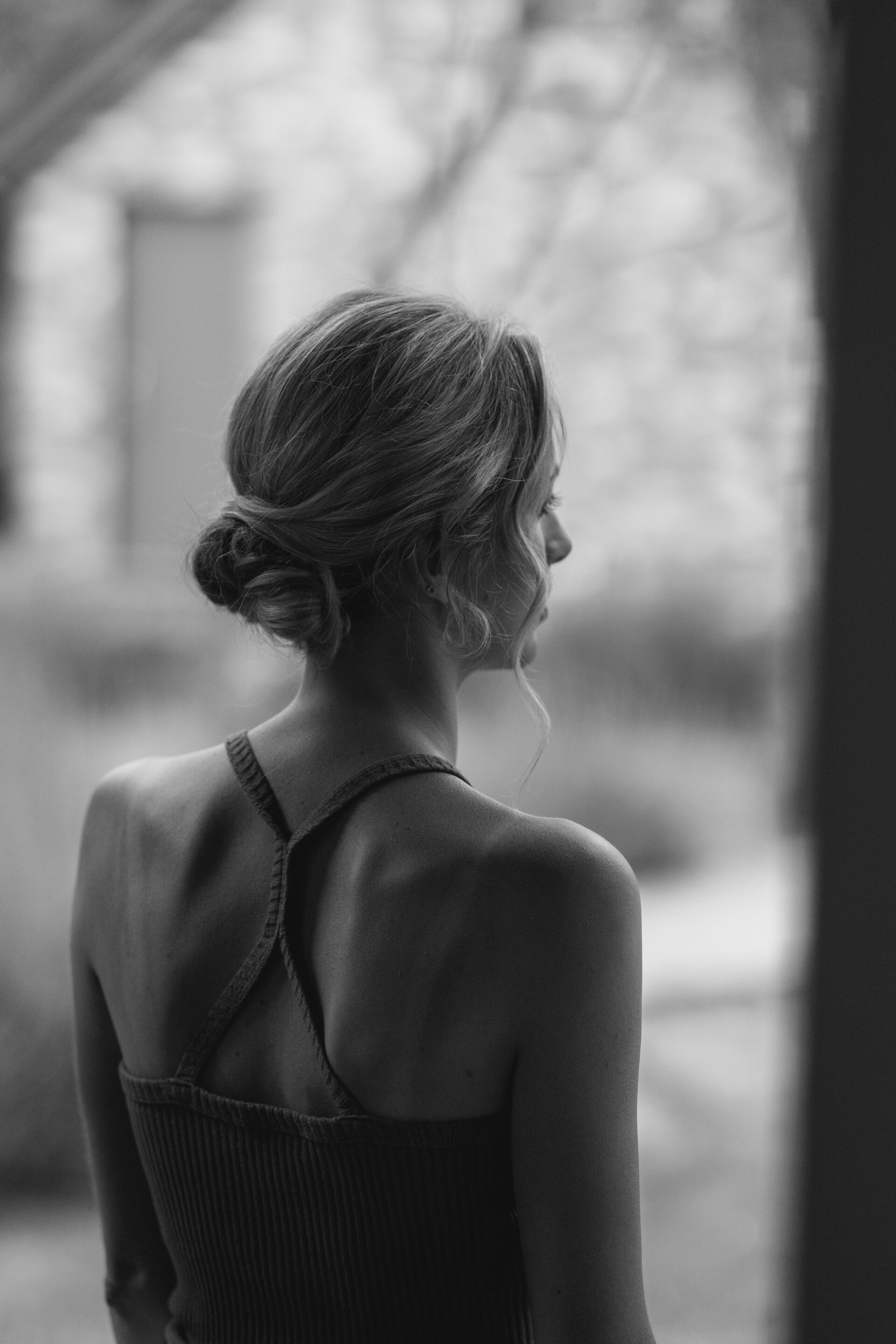 The bride has a moment of contemplation as she gets ready for her wedding