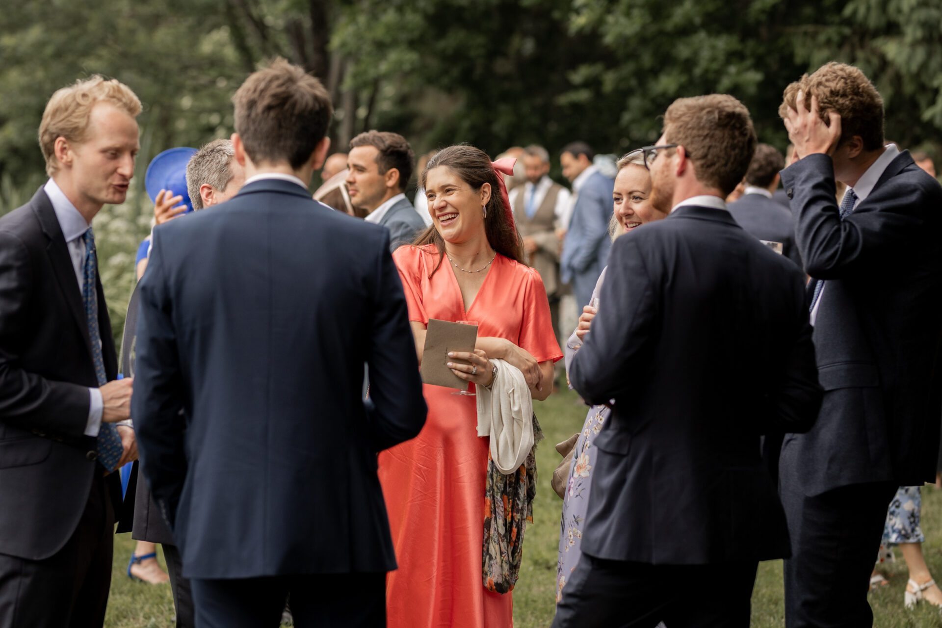Guests converse during the drinks reception at this Devon marquee wedding