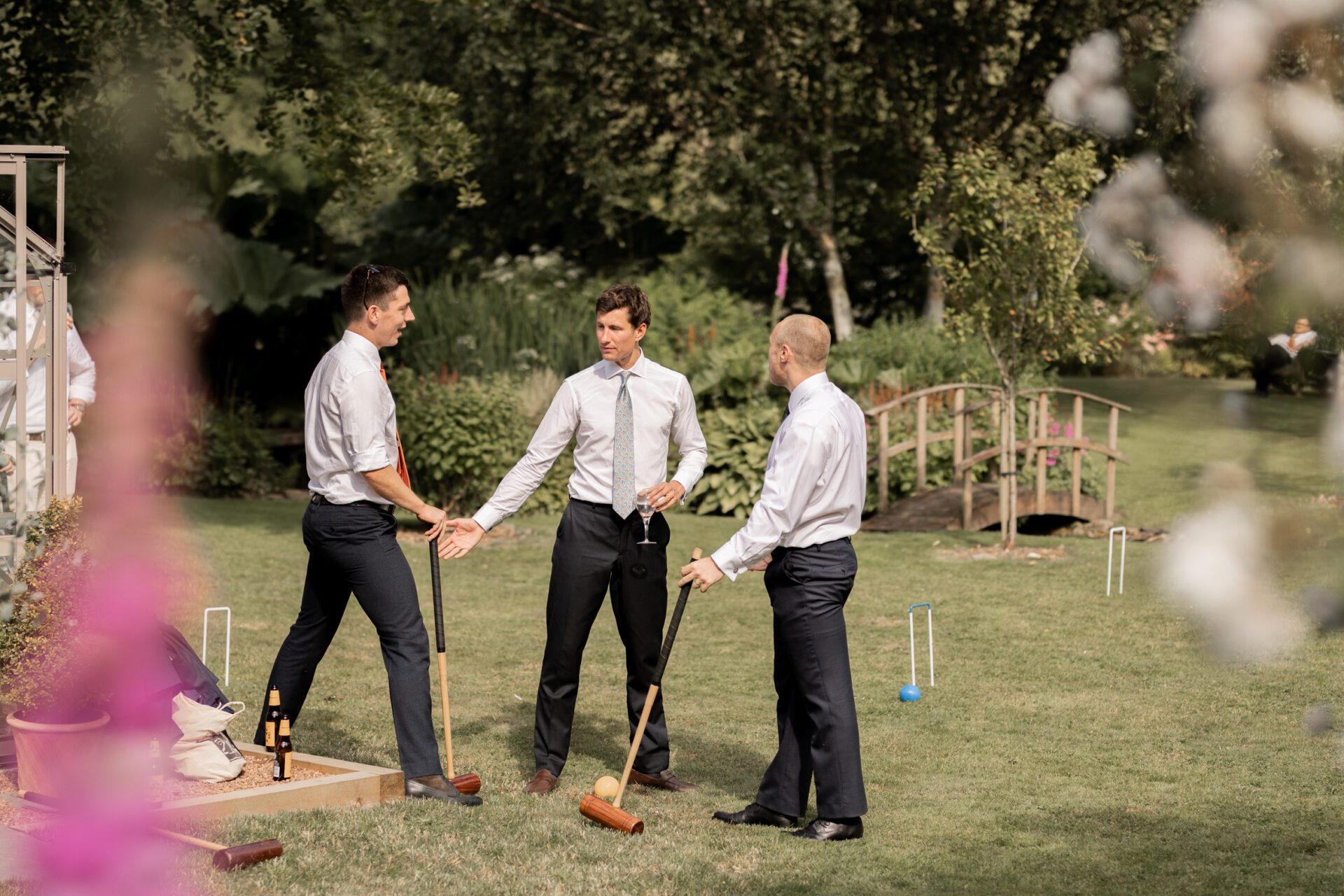 Wedding guests enjoy a game of croquet