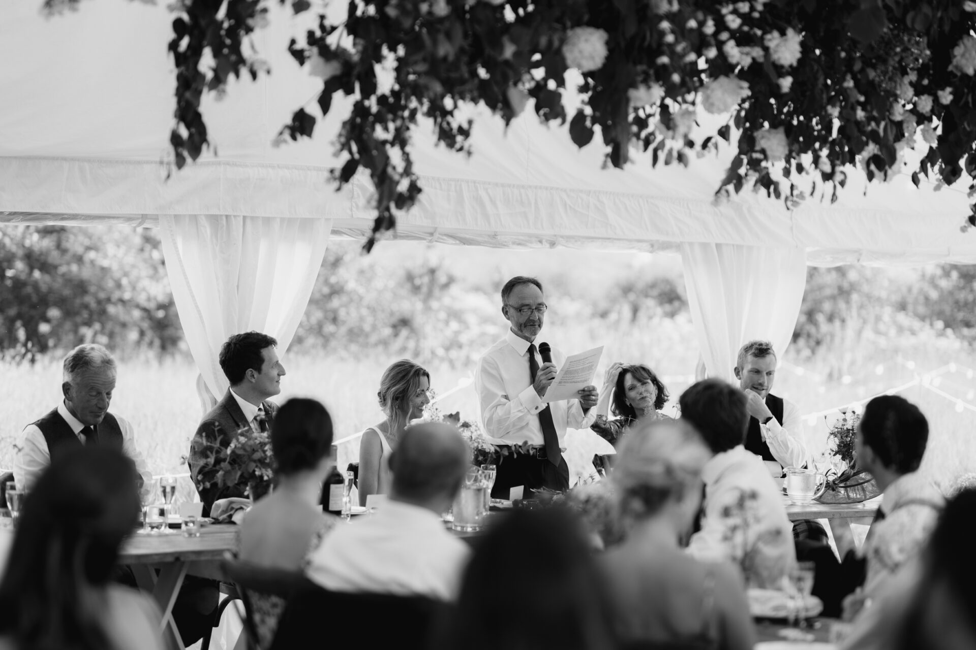 The father of the bride gives a speech at a Devon marquee wedding