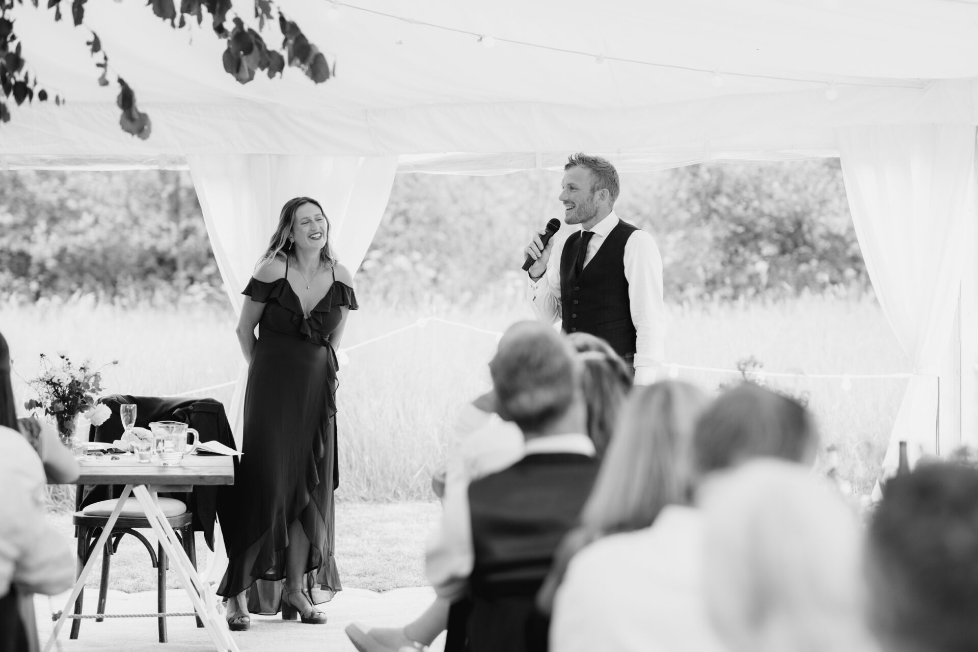 The maid of honour and best man give a wedding speech