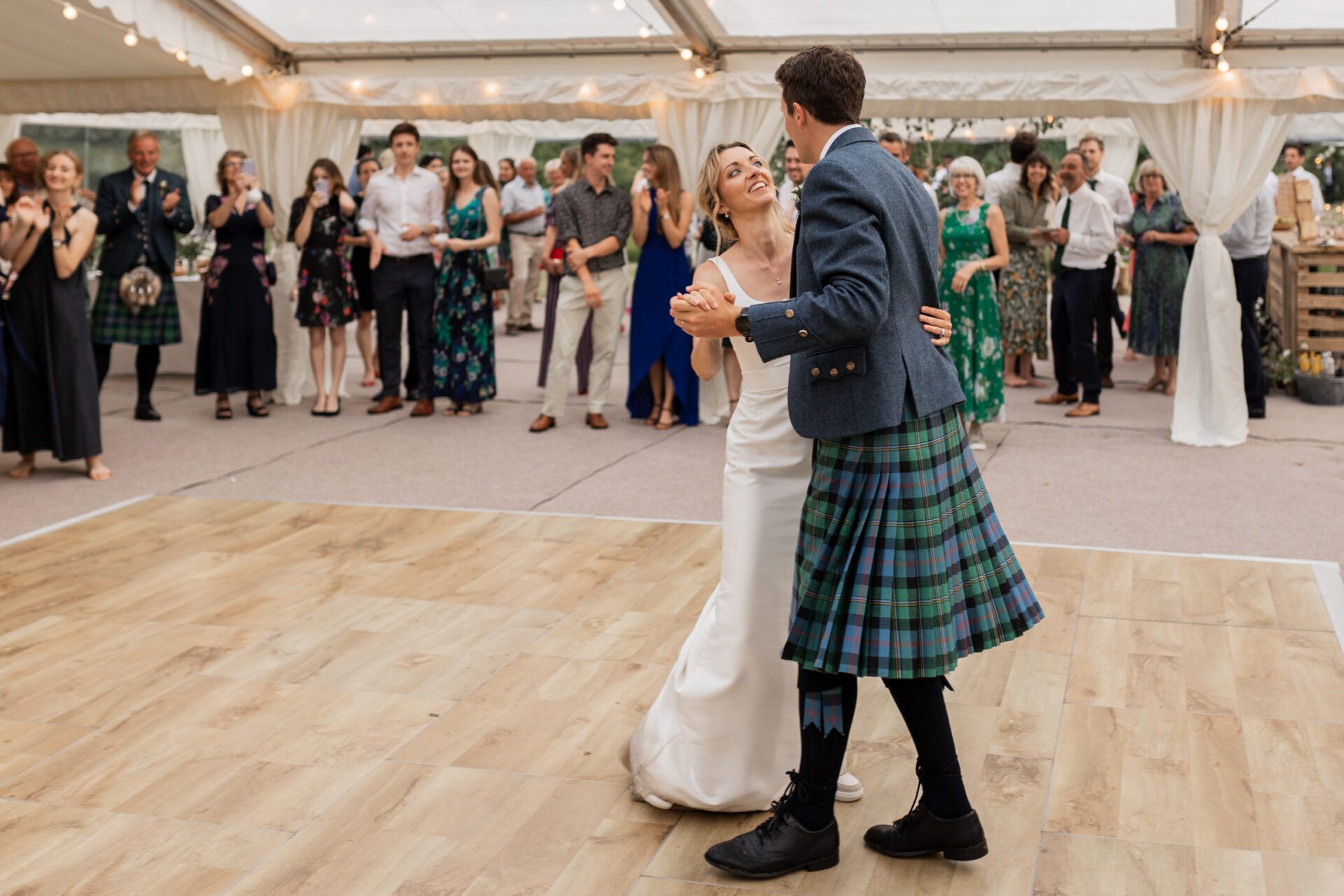 The bride and groom have their first dance at their Devon marquee wedding