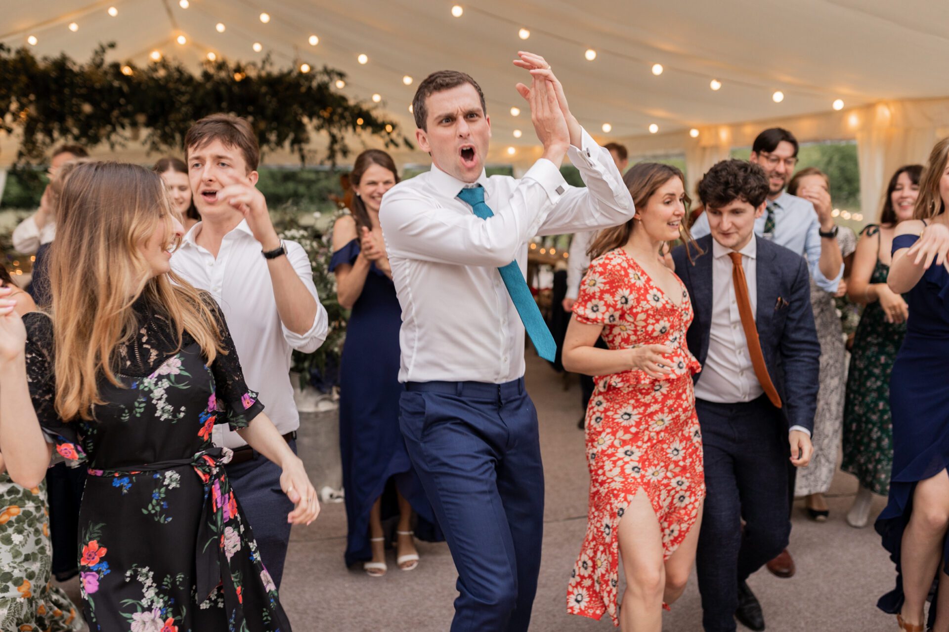 Wedding guests dance at a Devon marquee wedding