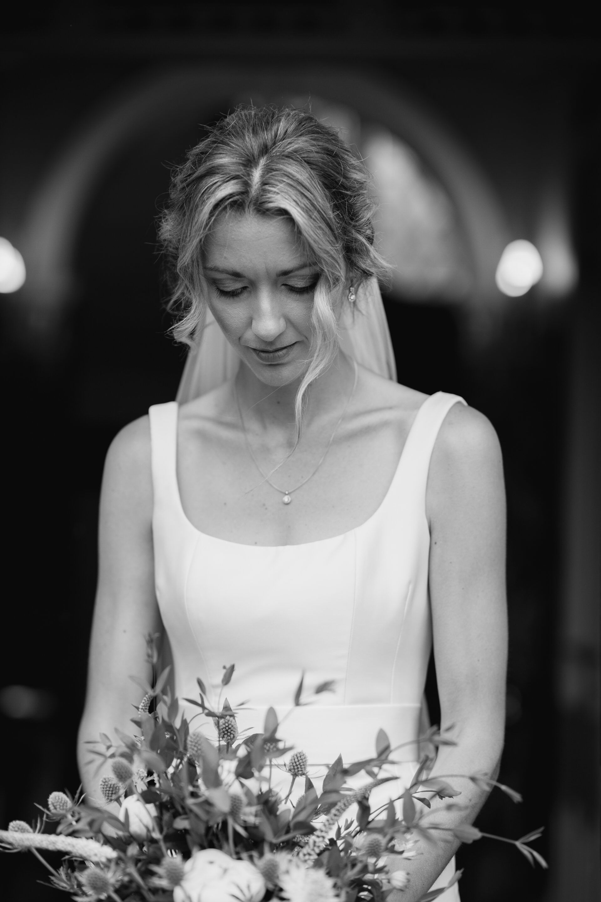 The bride admires her wedding flowers