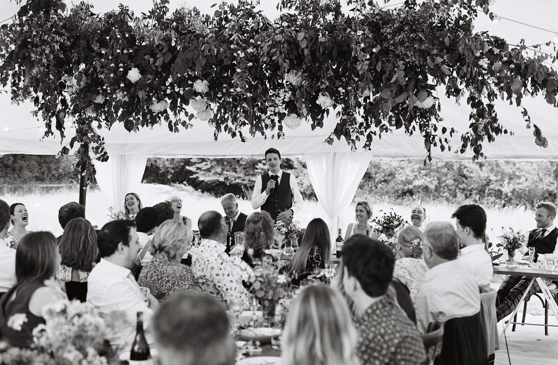 The groom gives a wedding speech, captured on 35mm film