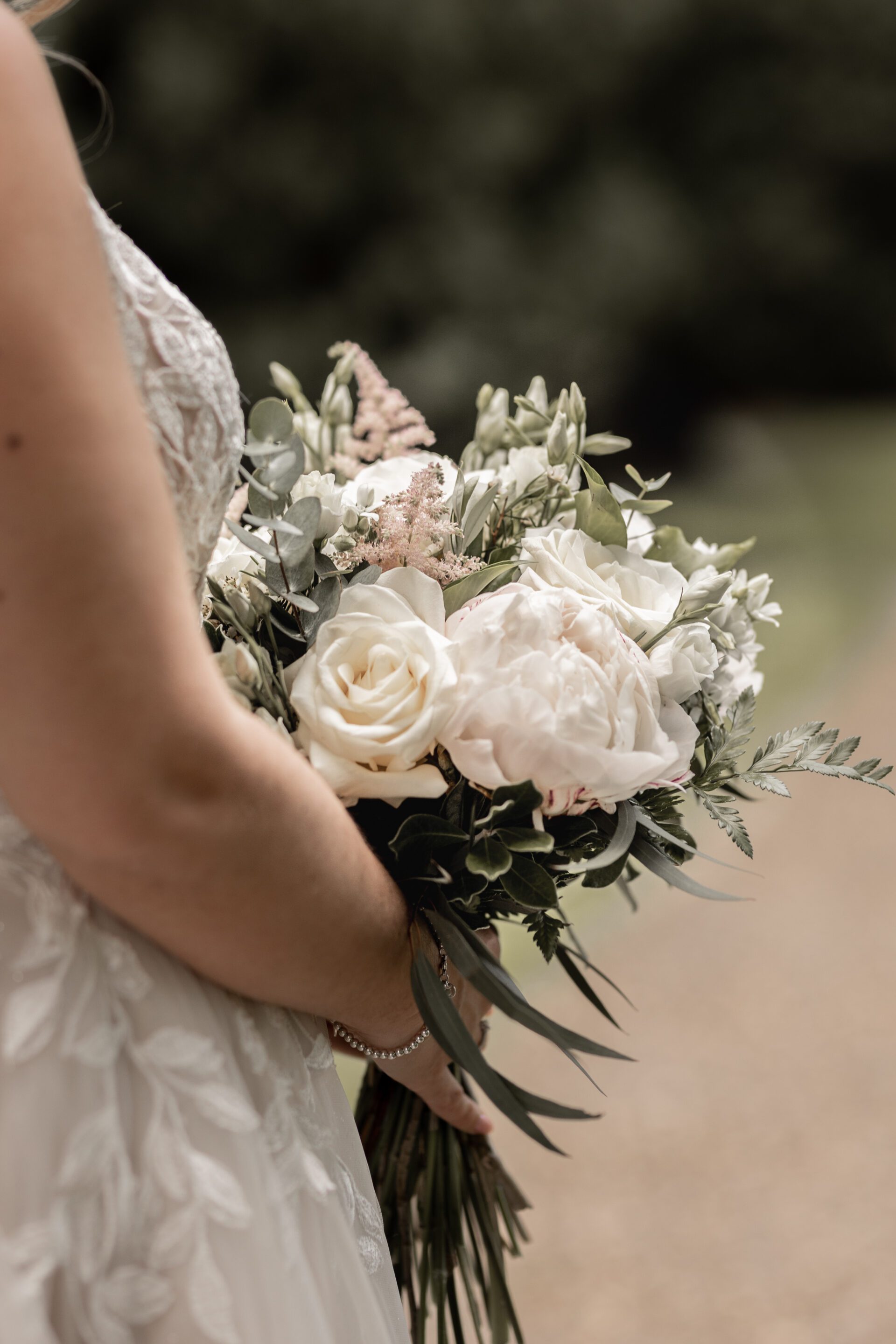 The bride holds a beautiful bouquet from Sonning Flowers