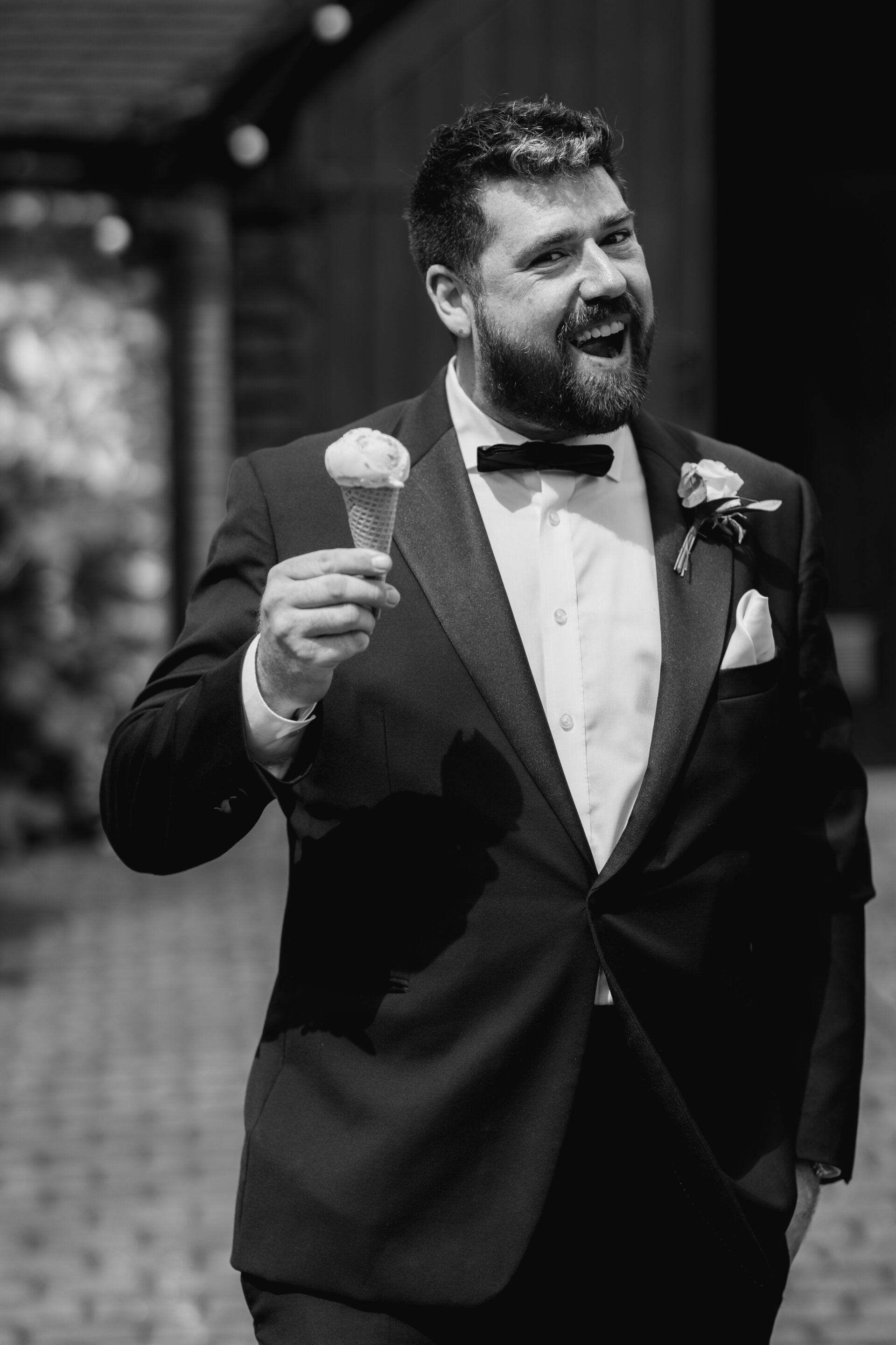 A wedding guest enjoys an ice cream