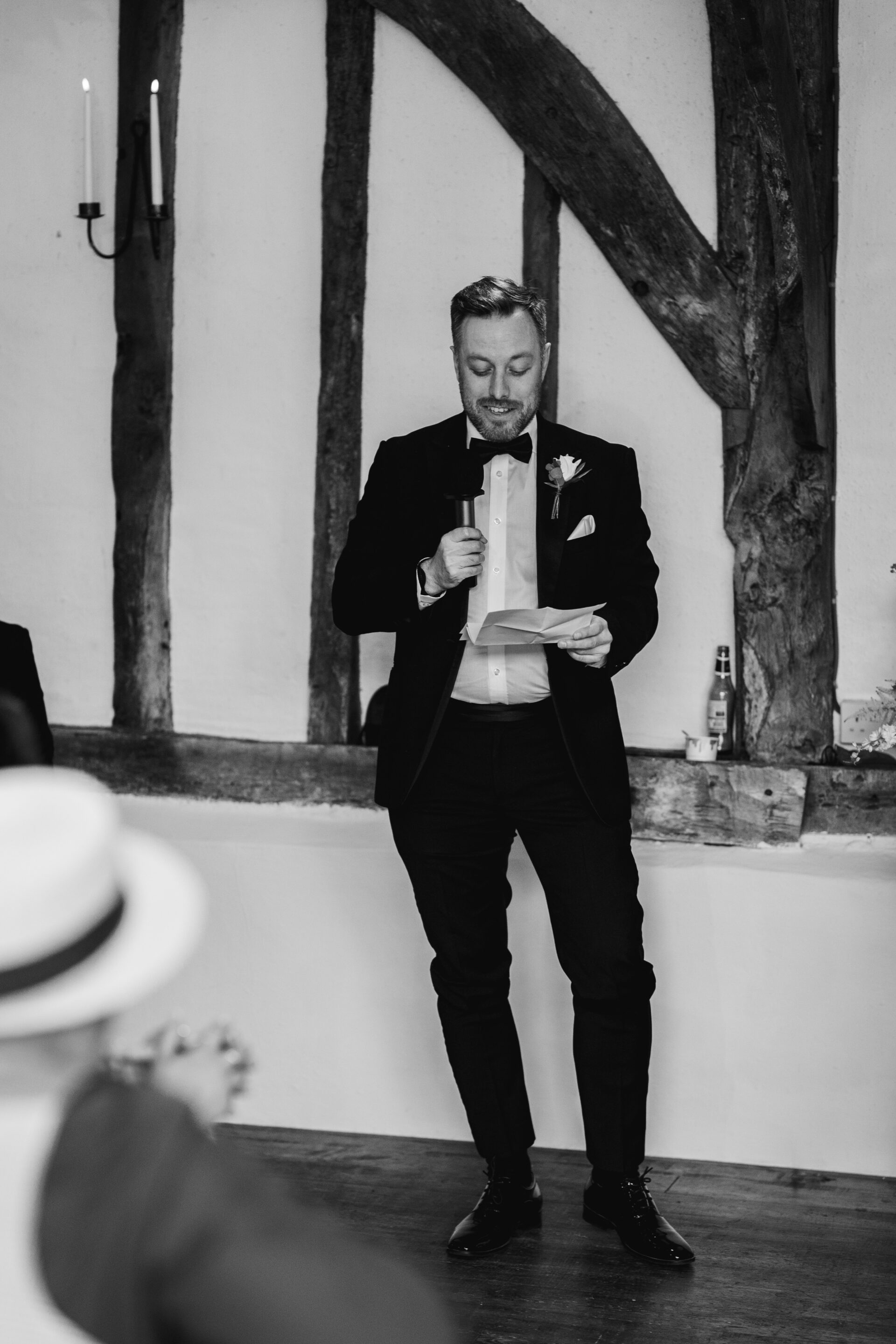 The best man gives a speech at Old Luxters Barn wedding venue in Oxfordshire