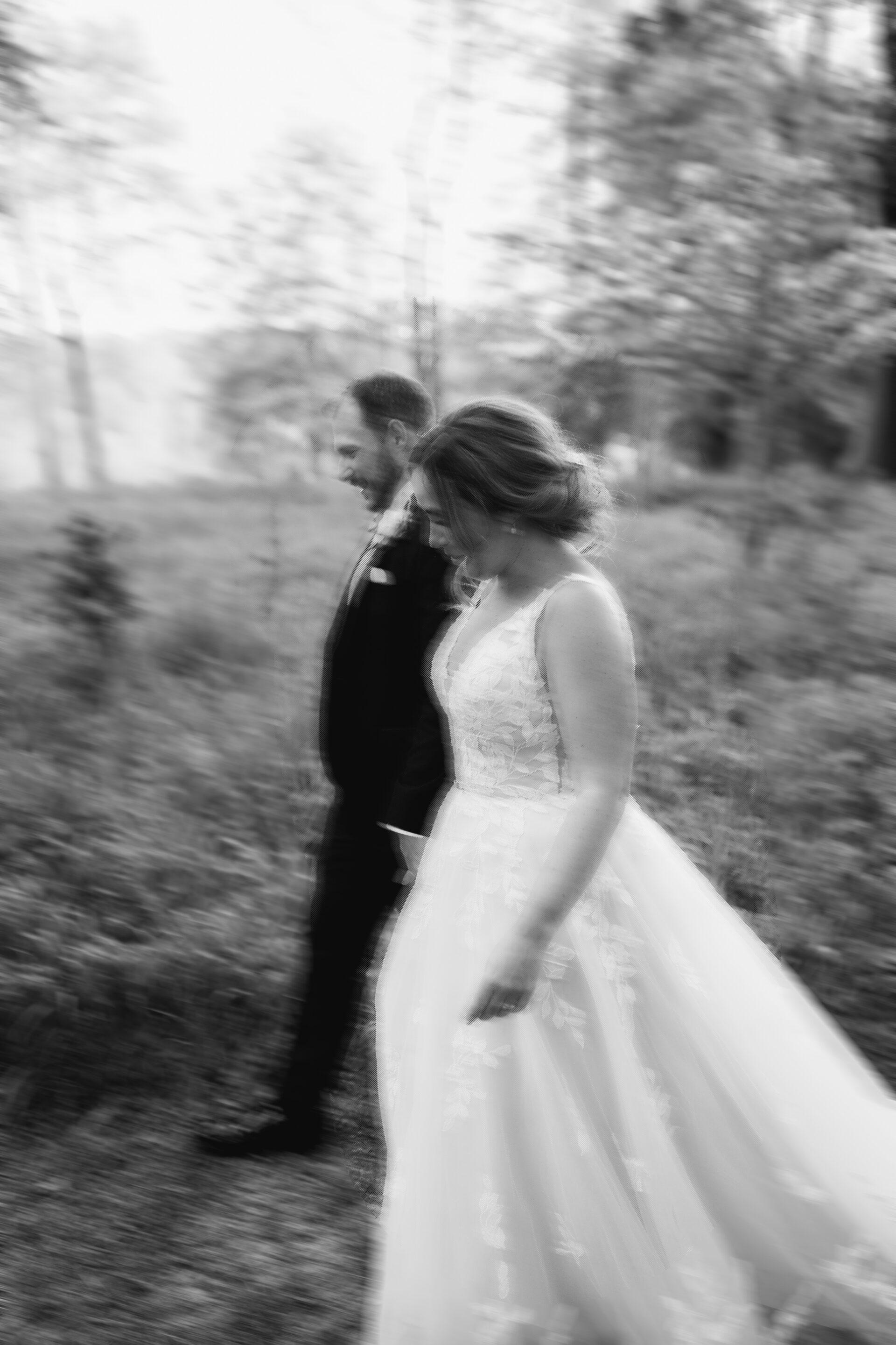 An editorial style shot of the bride and groom at Old Luxters Barn in Oxfordshire