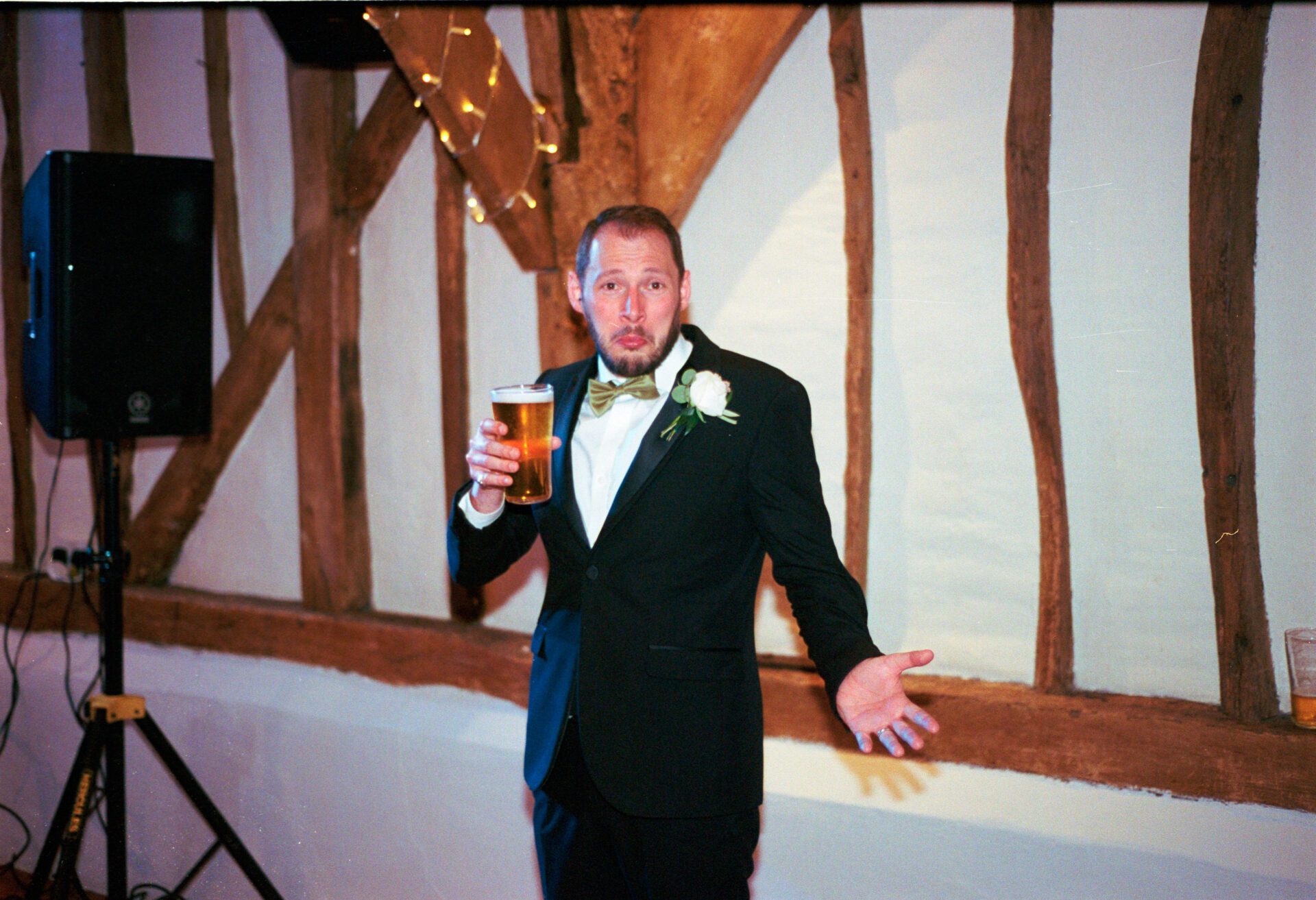 Groom enjoys wedding party on 35mm film