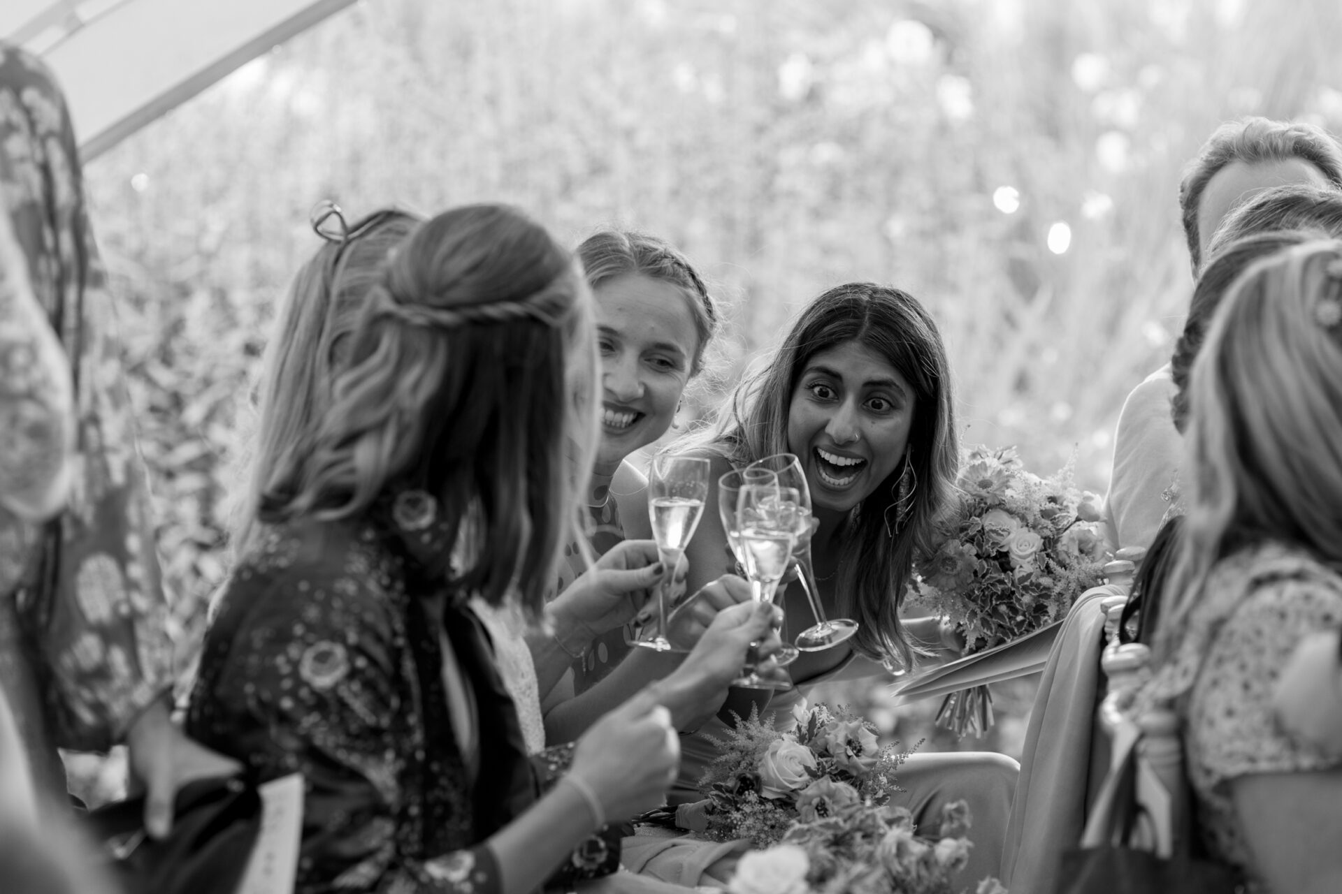 Wedding guests share a laugh at Brickwall House