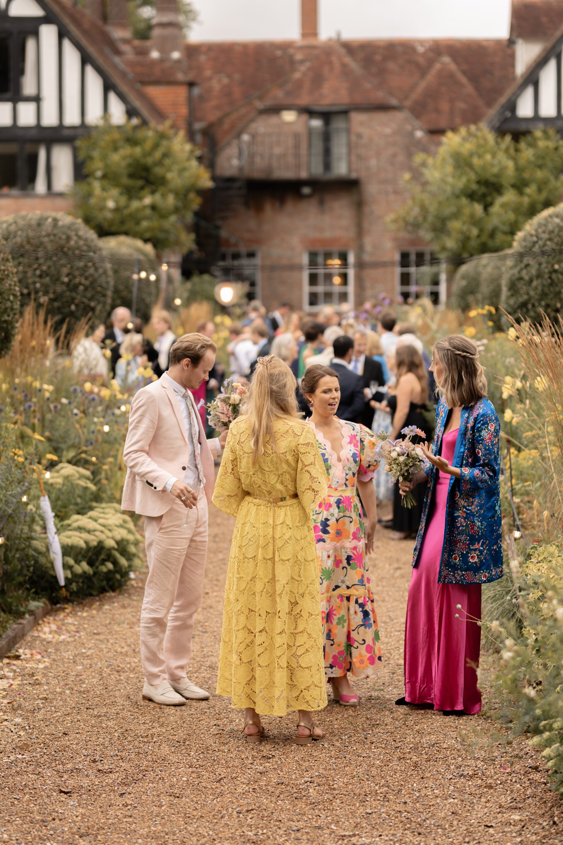Wedding guests mingle at Brickwall House, Kent wedding venue