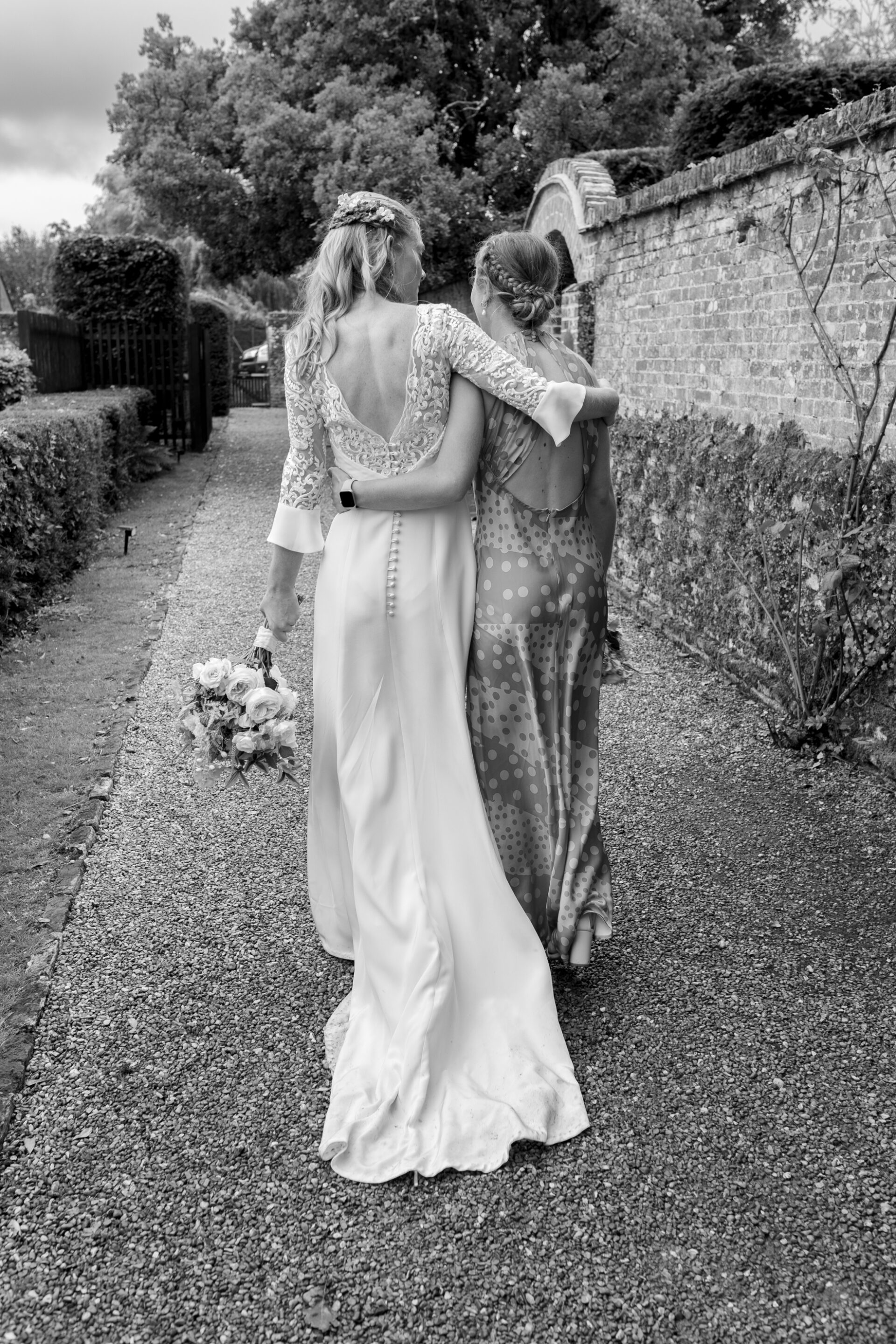 The bride embraces a guest at her Kent wedding