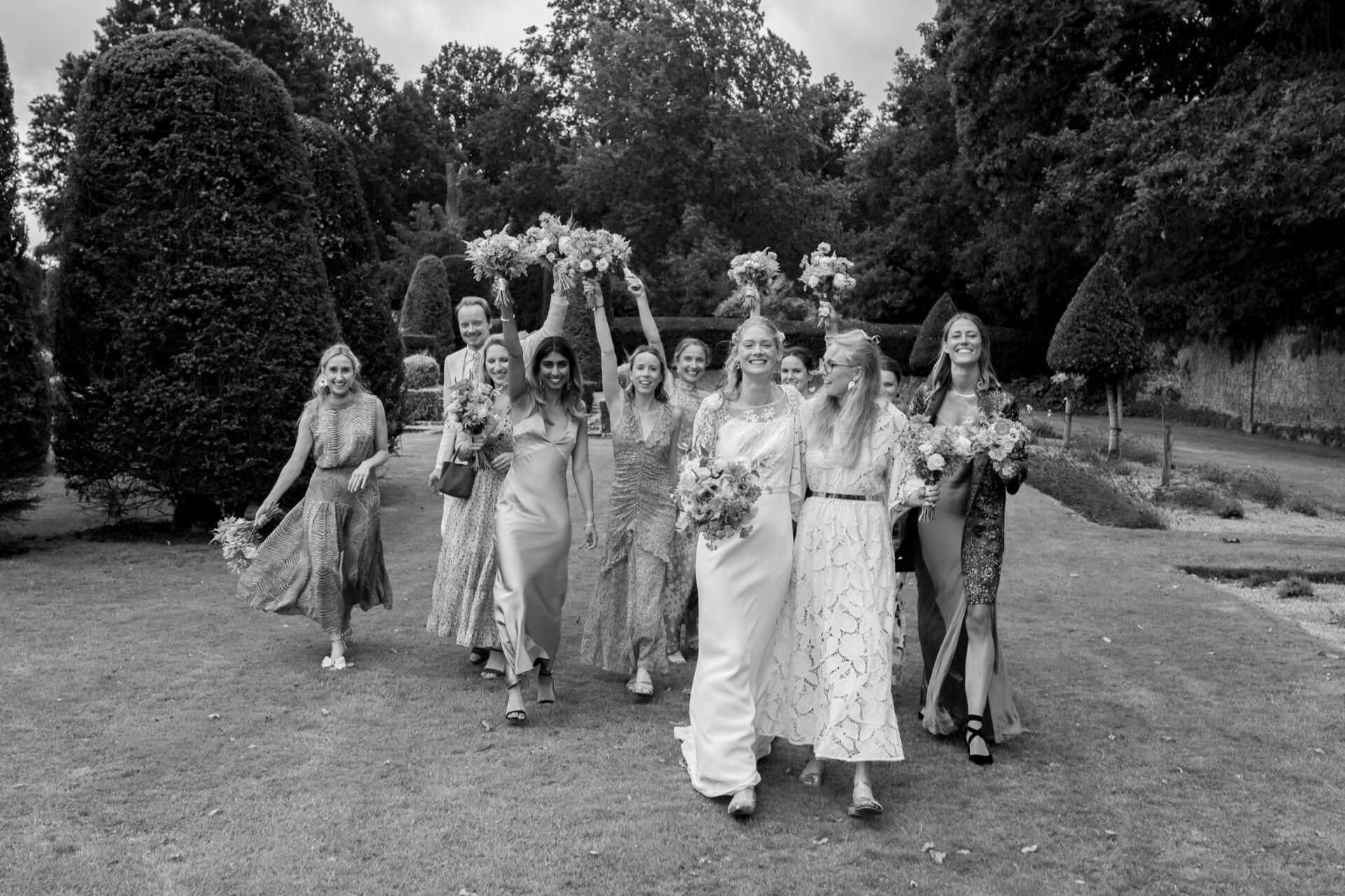 The bridal party embrace at Brickwall House