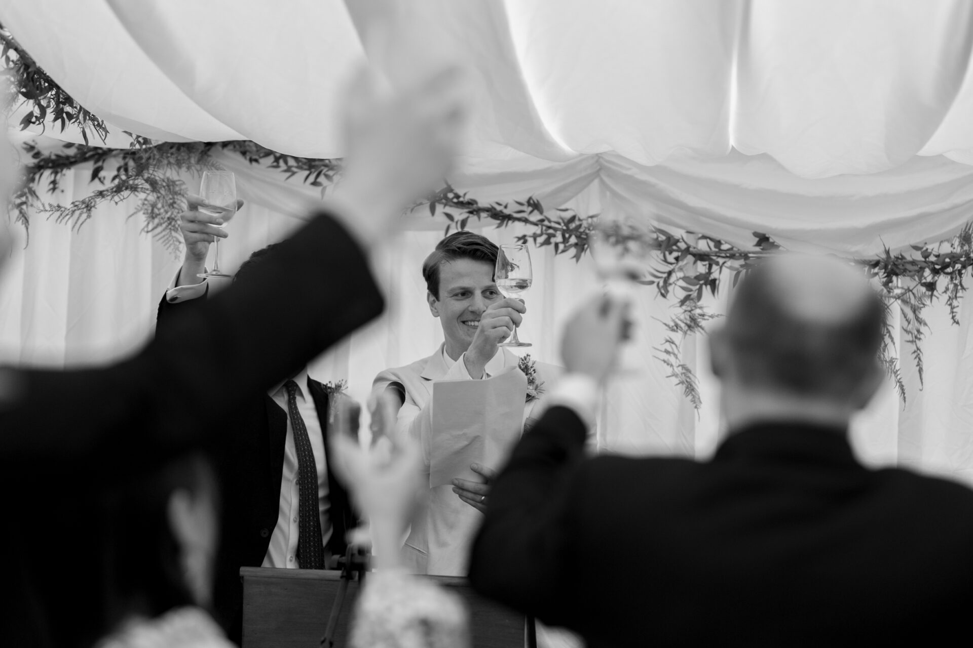 Wedding guests enjoy a toast at Kent wedding