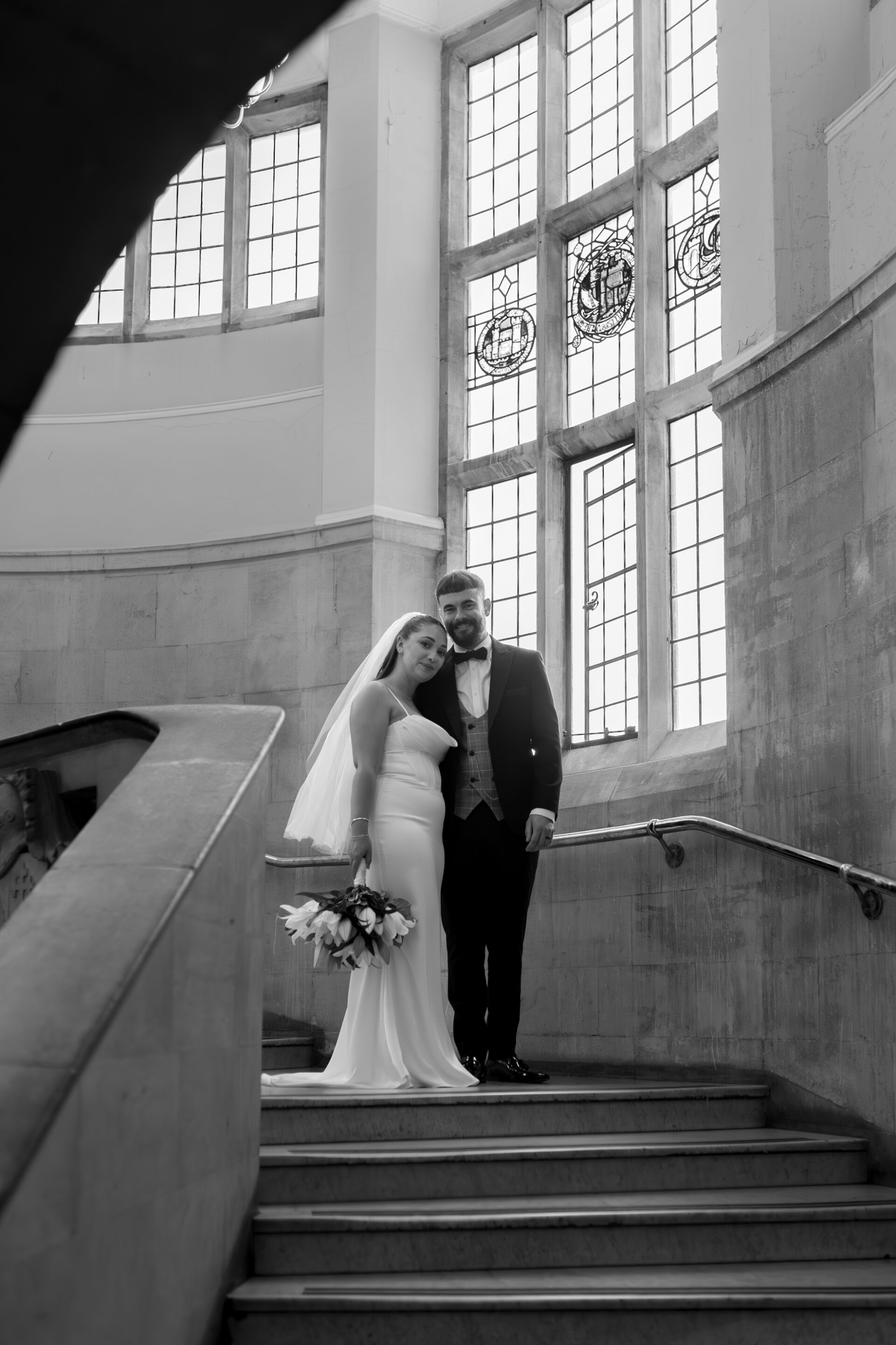 A classic black and white couple portrait of our bride and groom at Bristol Library