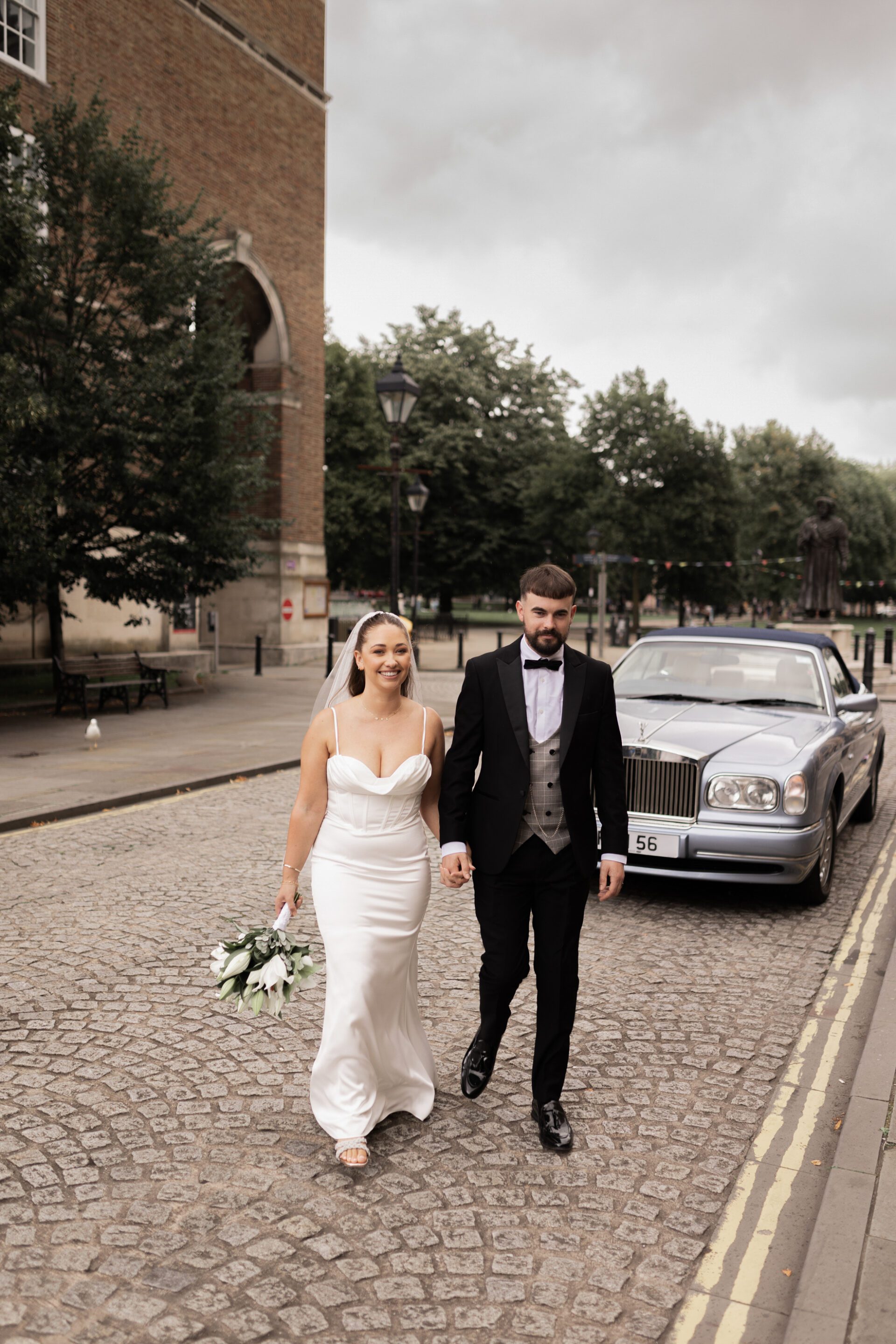 The bride and groom explore the centre of Bristol during their couple portrait session
