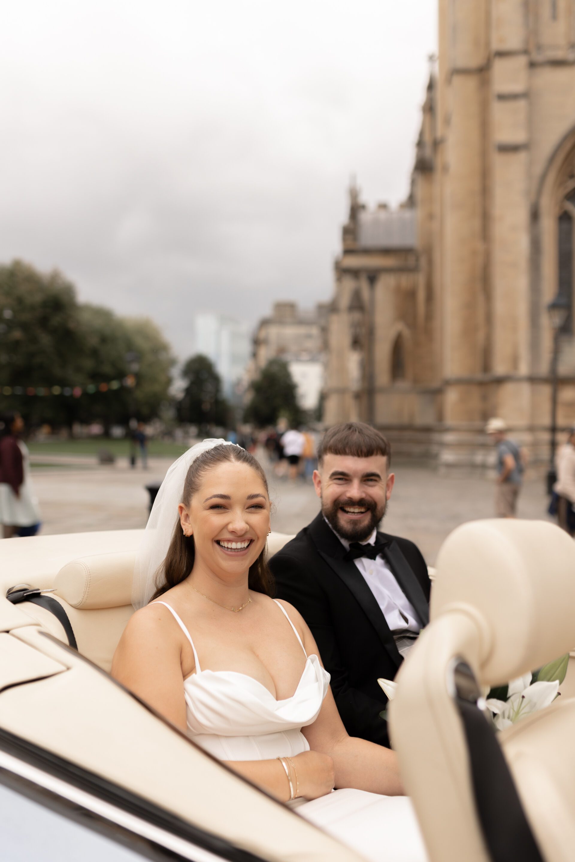 Couple portraits in a classic vintage wedding car during our editorial couples portrait session