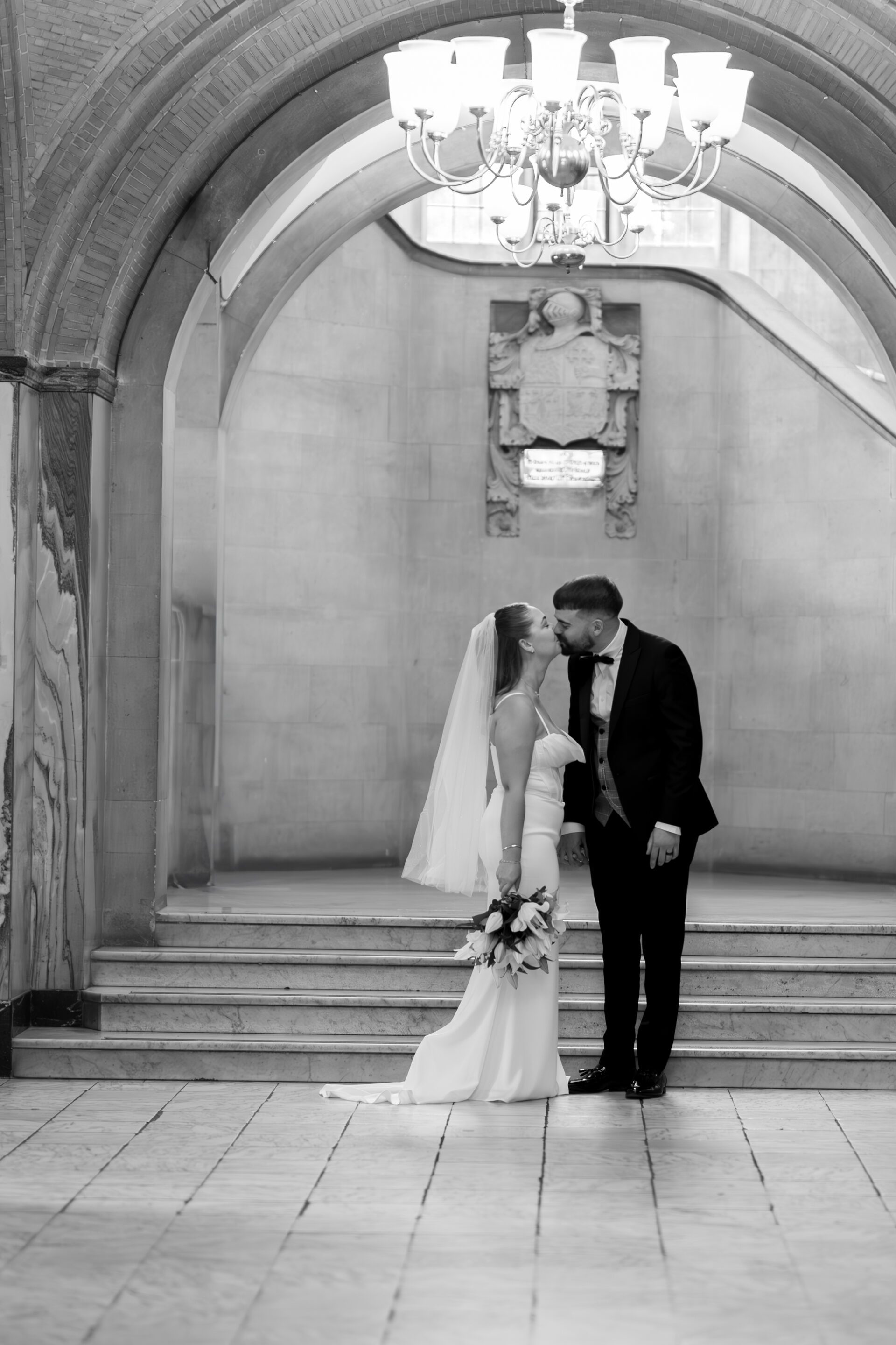 Our bride and groom pose for couple portraits at the iconic Bristol Library