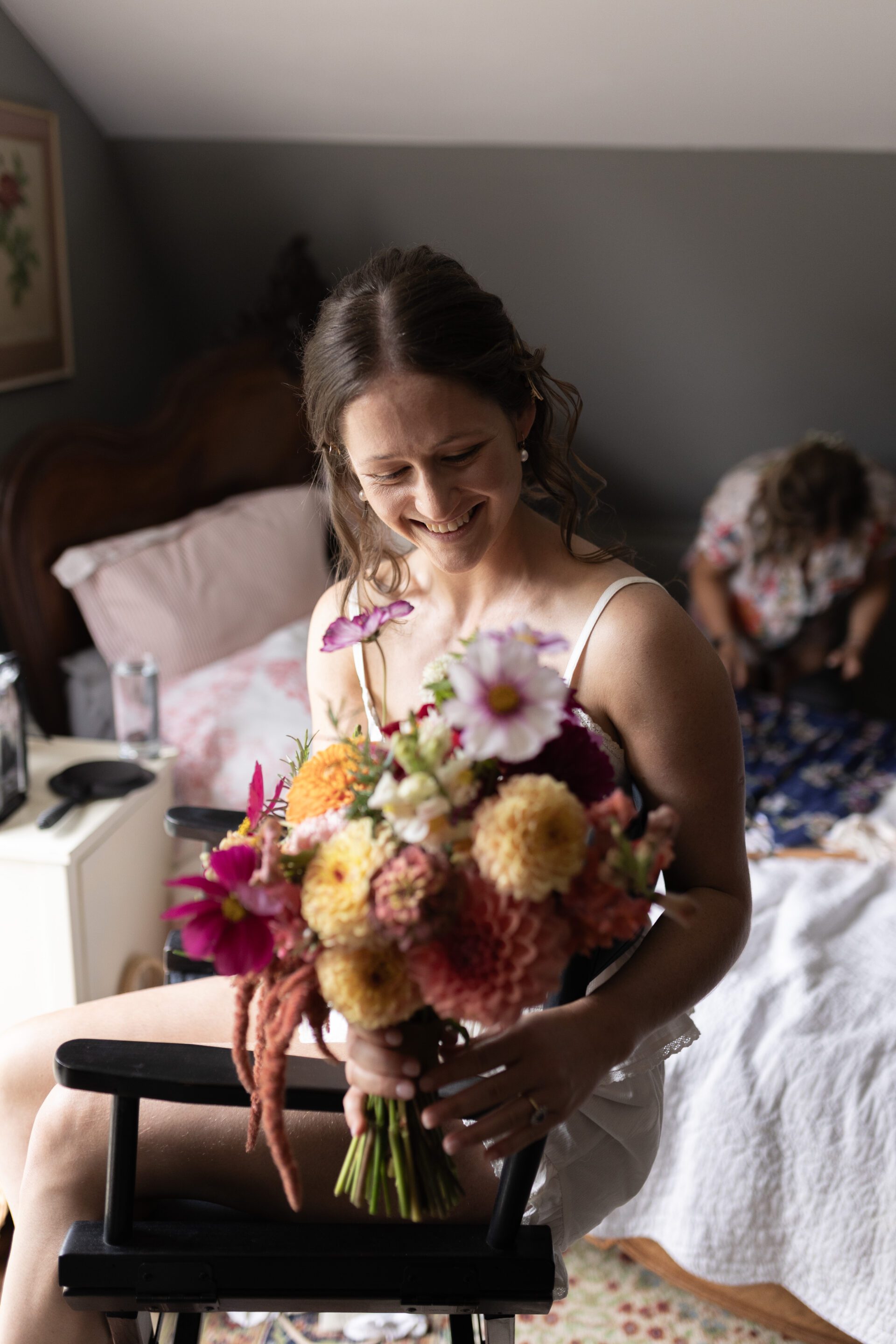 The bride inspects her beautiful bouquet