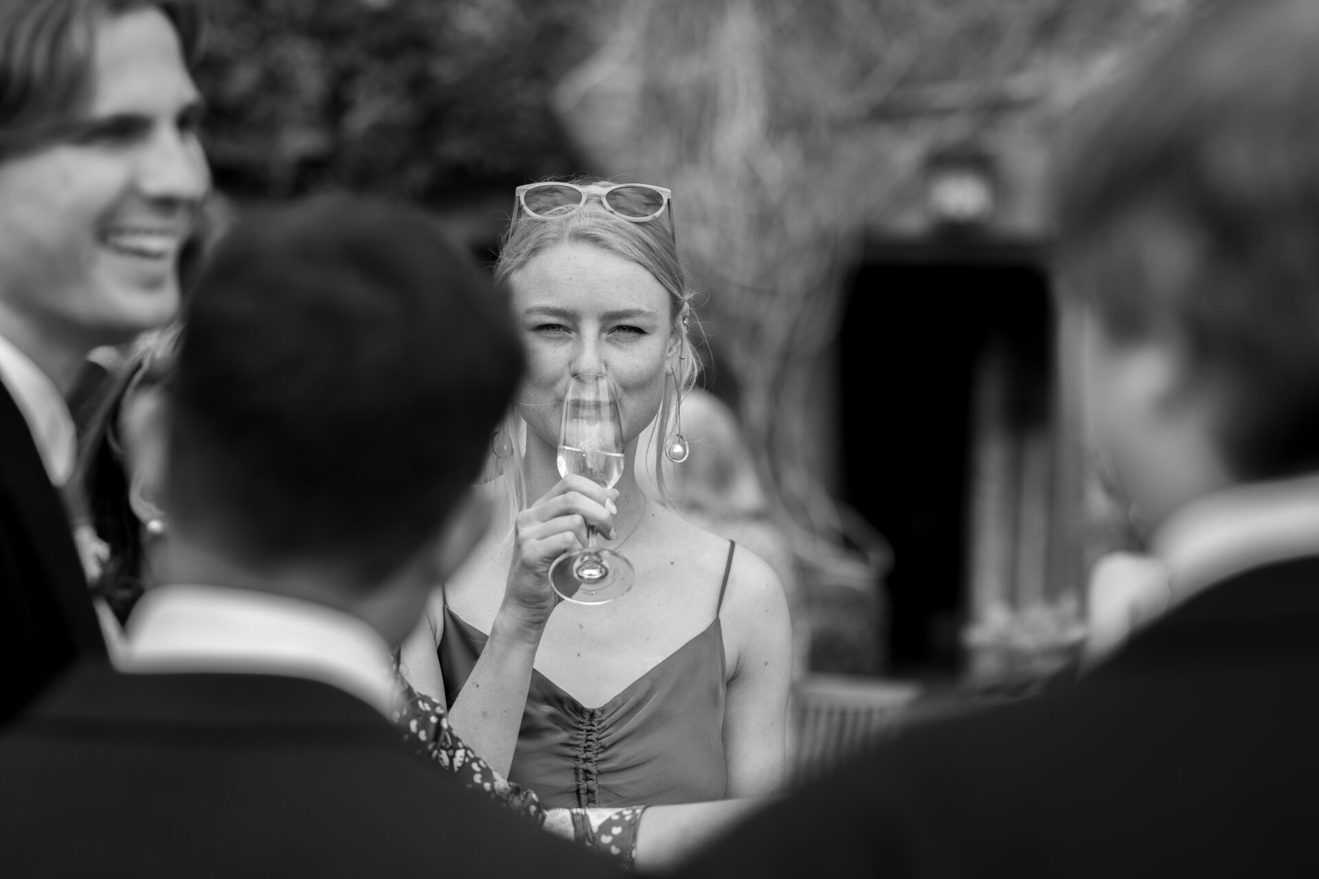 A guest enjoys a drink at the Somerset marquee wedding reception