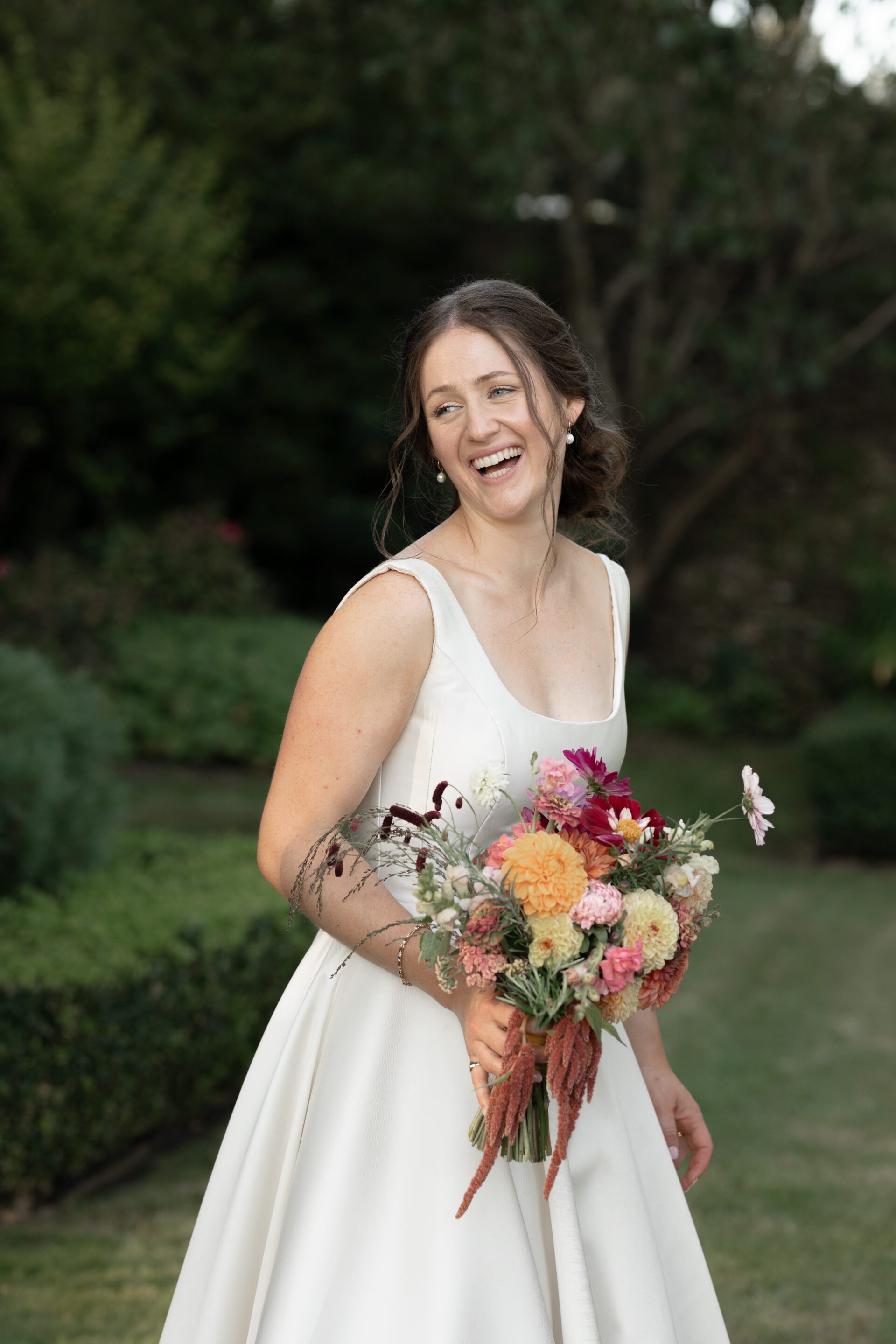 A bridal portrait taken outdoors at a Somerset marquee wedding reception