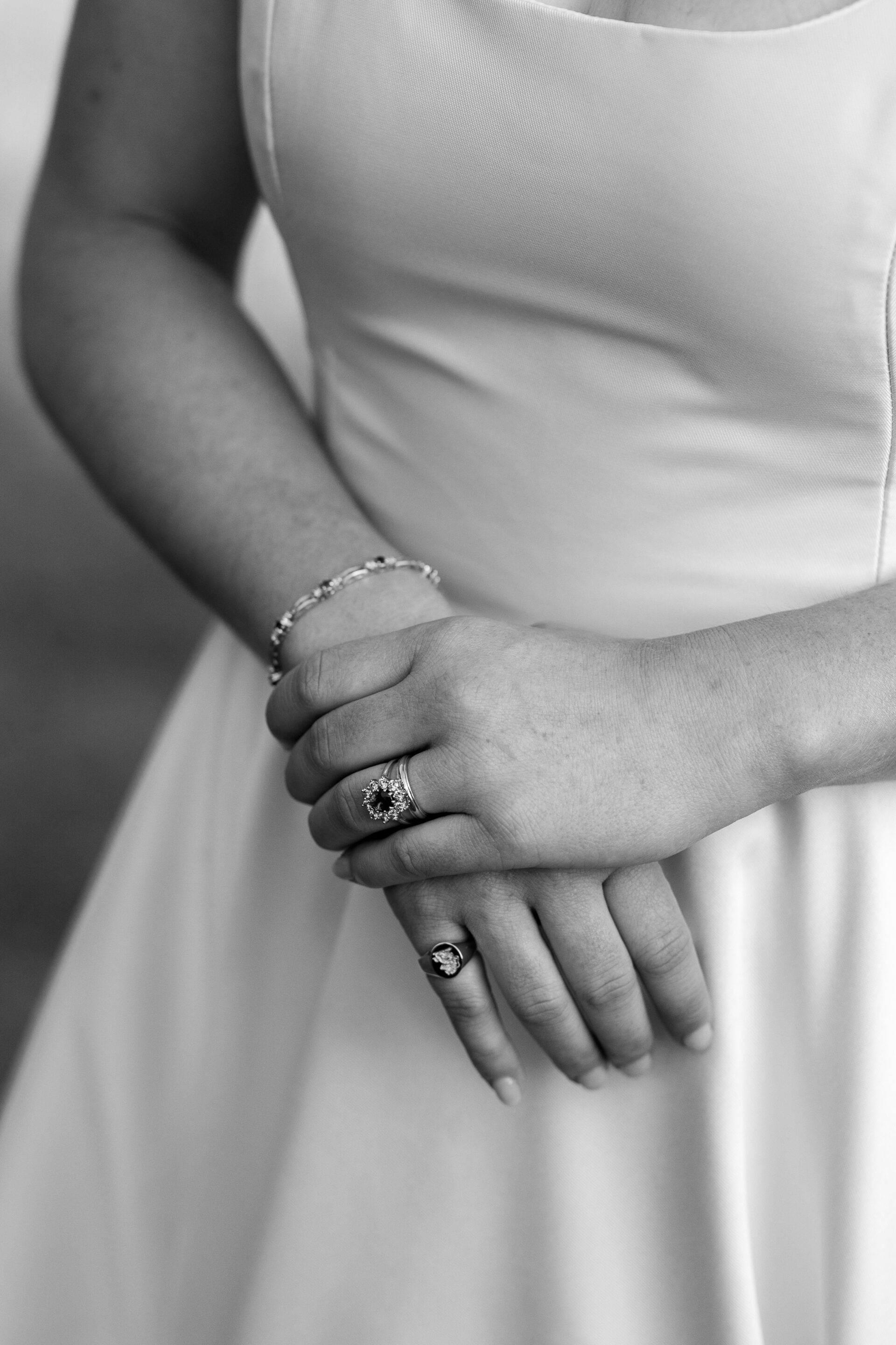 A detail shot of the bride's wedding ring and jewellery