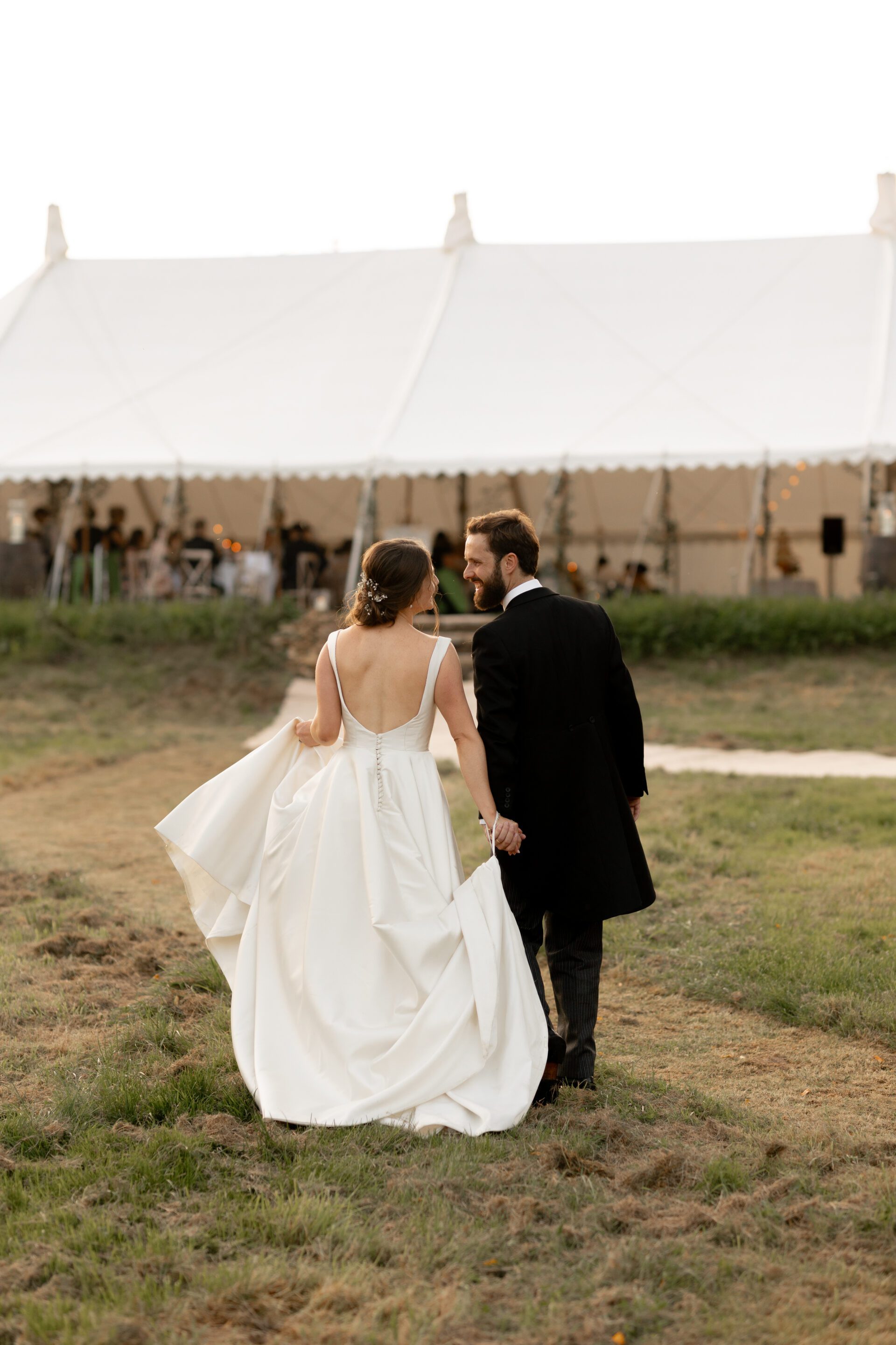 The bride and groom enjoying their Somerset marquee wedding