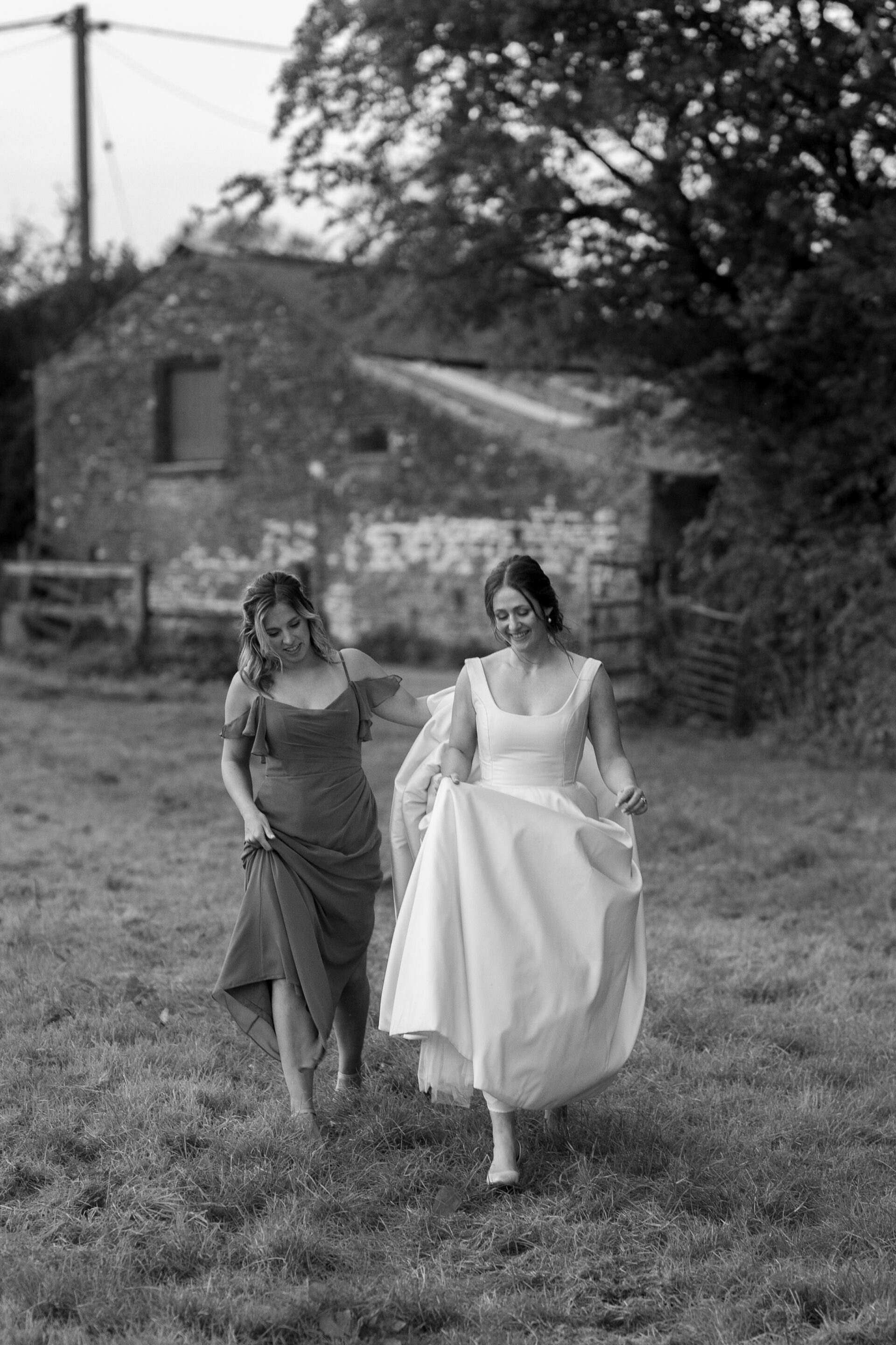The bride walks with her bridesmaid