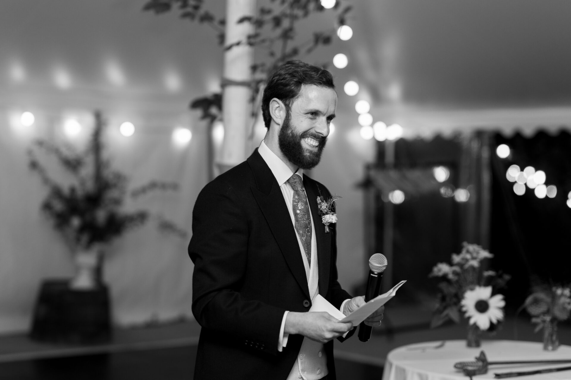 The groom gives a speech during his Somerset marquee wedding