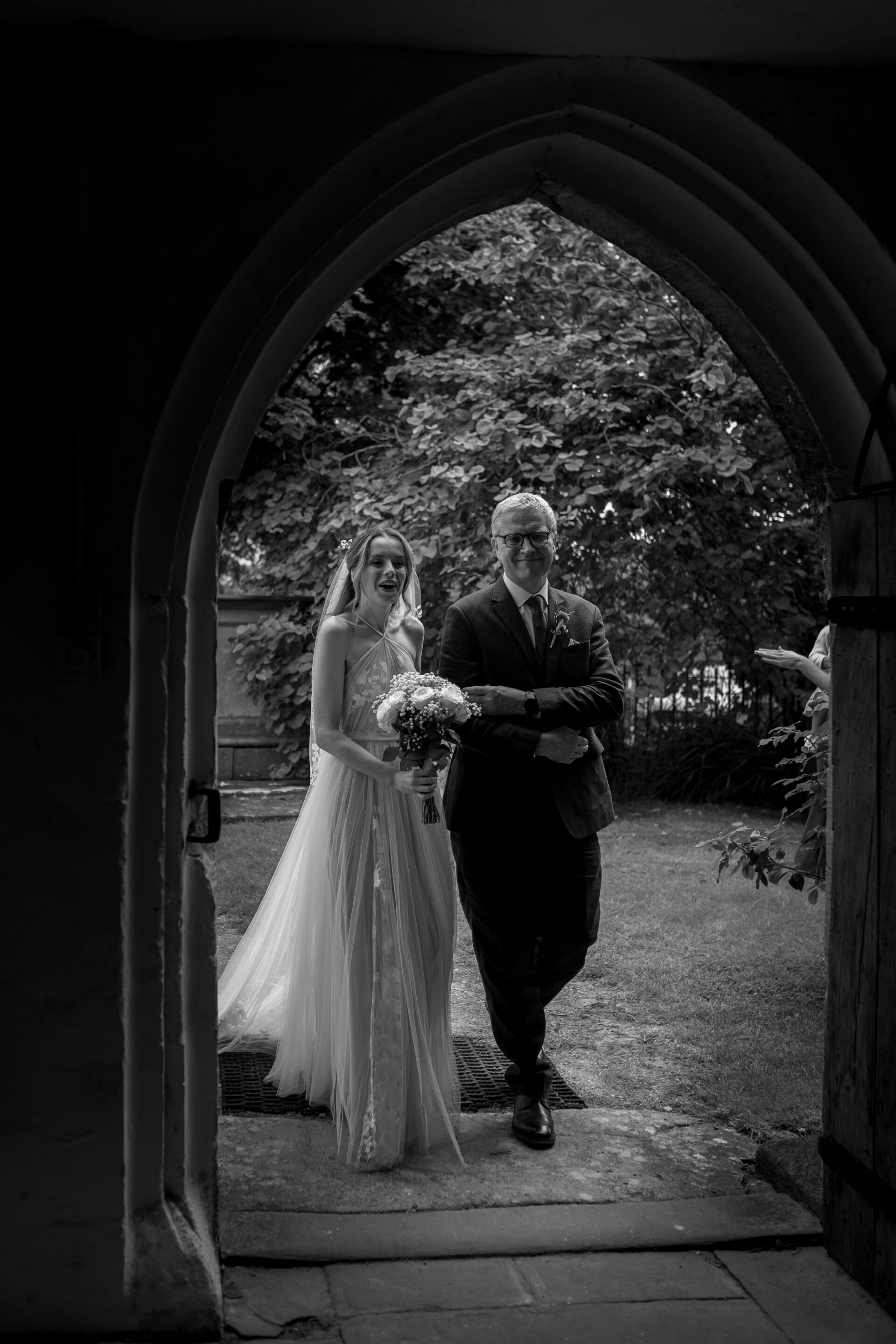 The bride arrives for her church ceremony at her Gloucestershire wedding