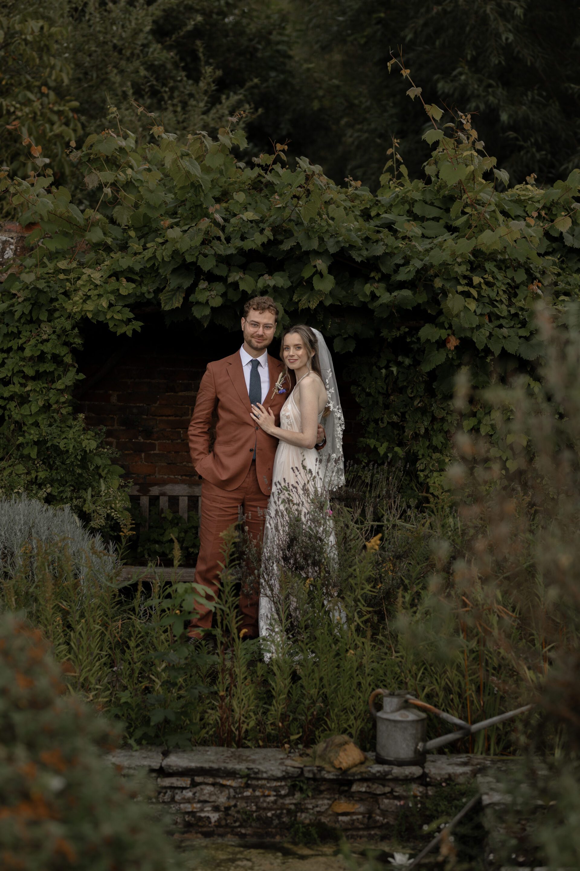 Editorial couples portraits in the grounds of the Wool Barn, Gloucestershire wedding venue in Frampton