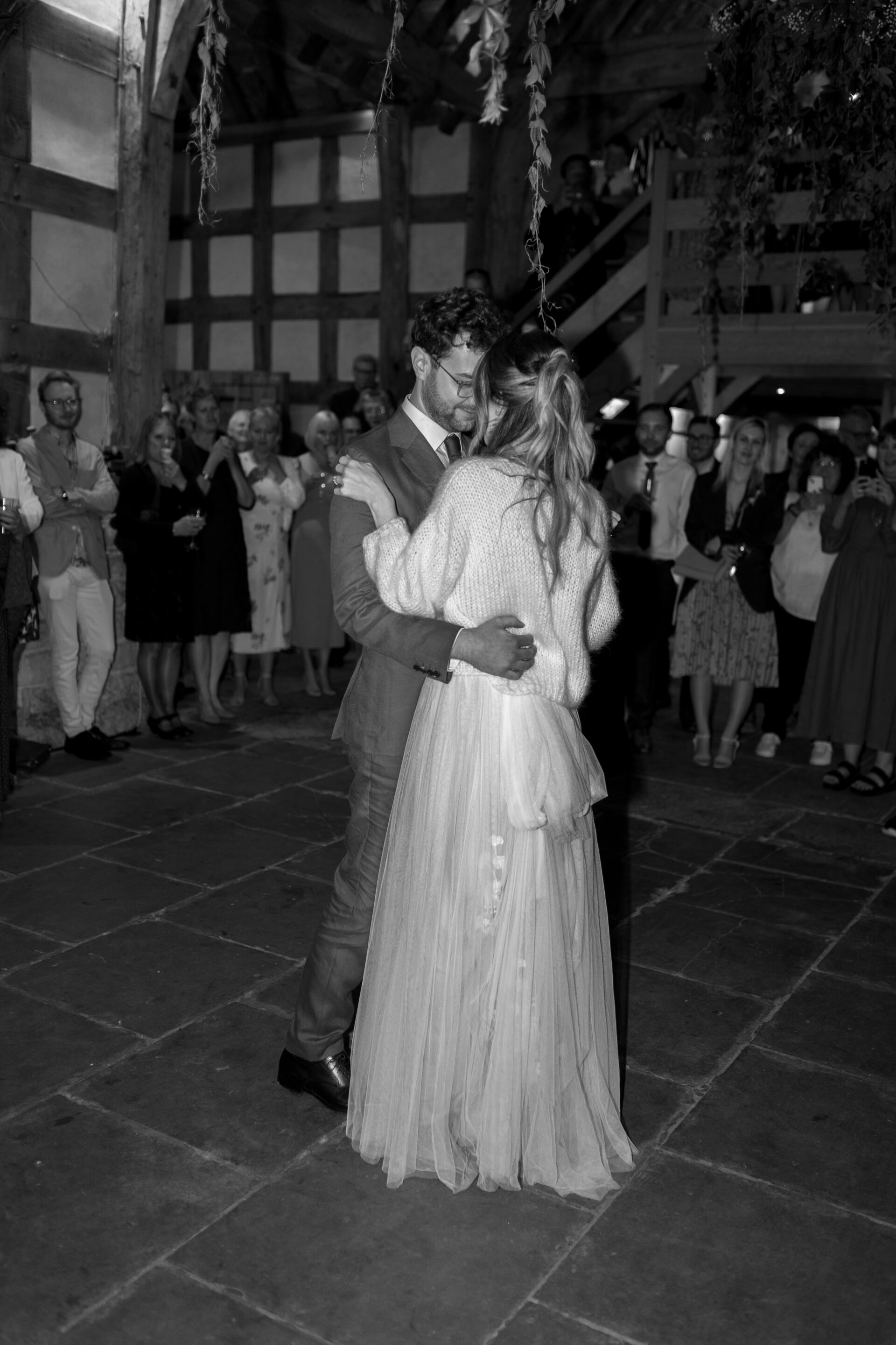 The bride and groom share their first dance at the Wool Barn, Gloucestershire wedding venue