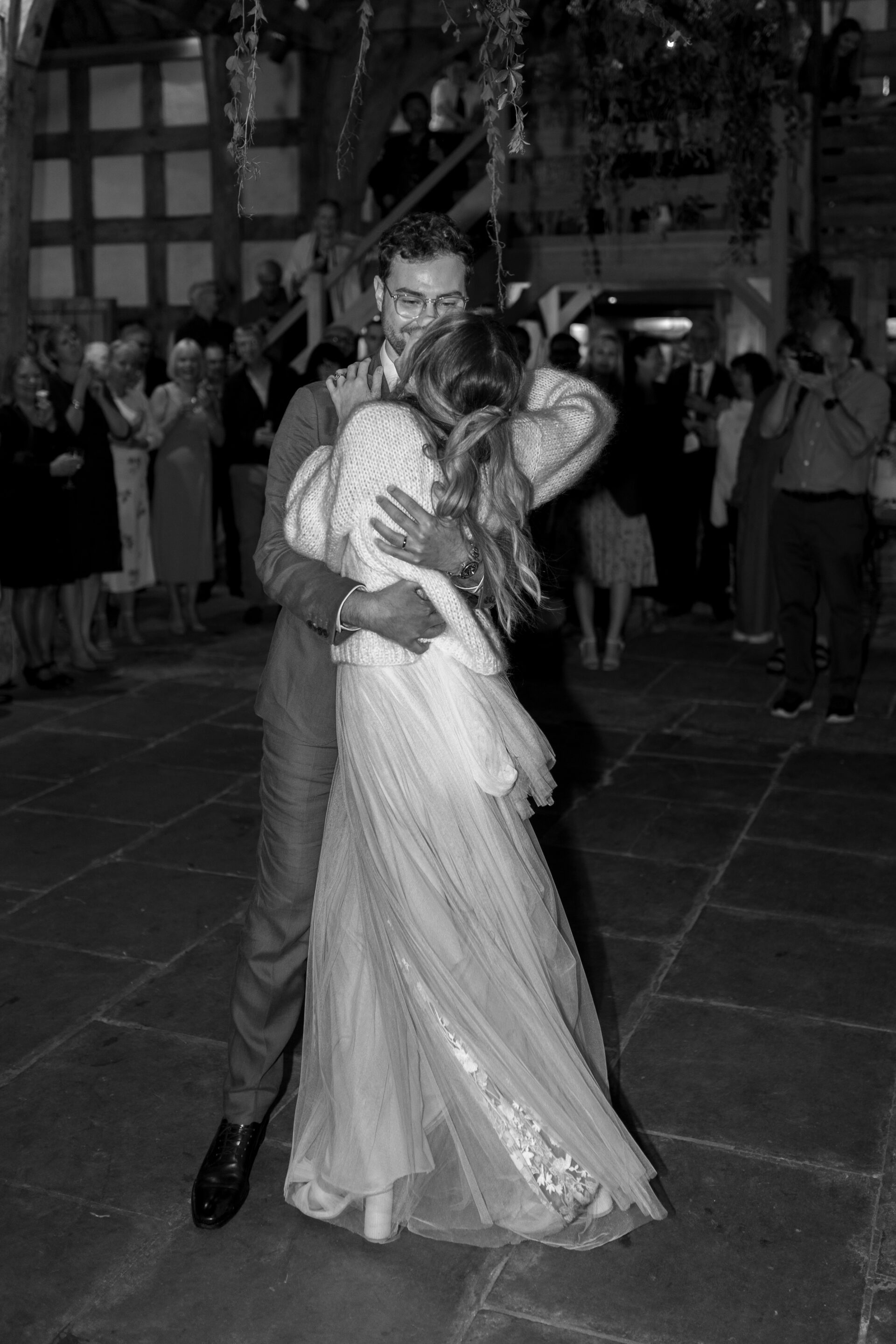 The bride and groom have their first dance at the Wool Barn, Gloucestershire wedding venue