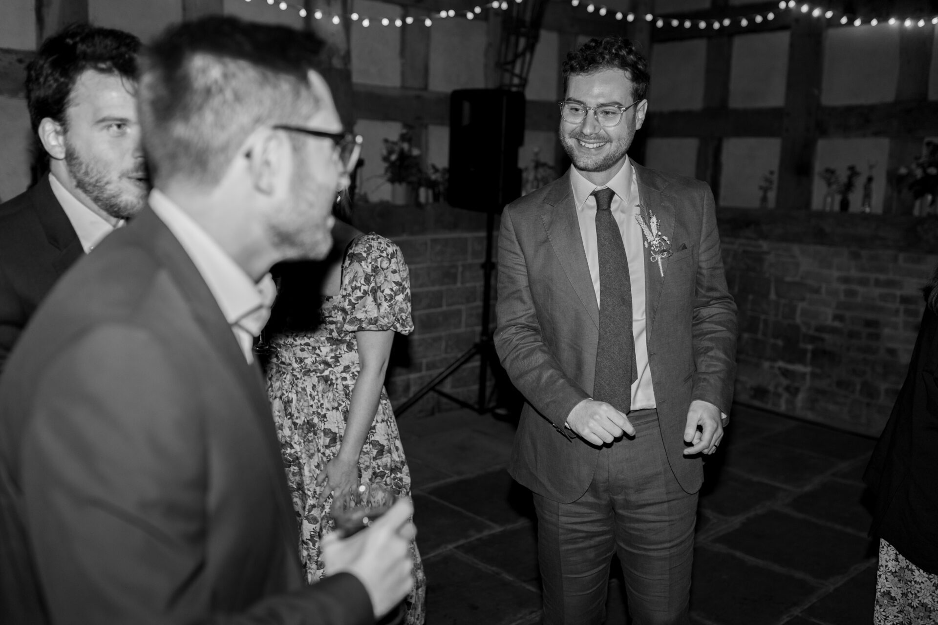 The groom dances with guests at the Wool Barn, Gloucestershire wedding venue