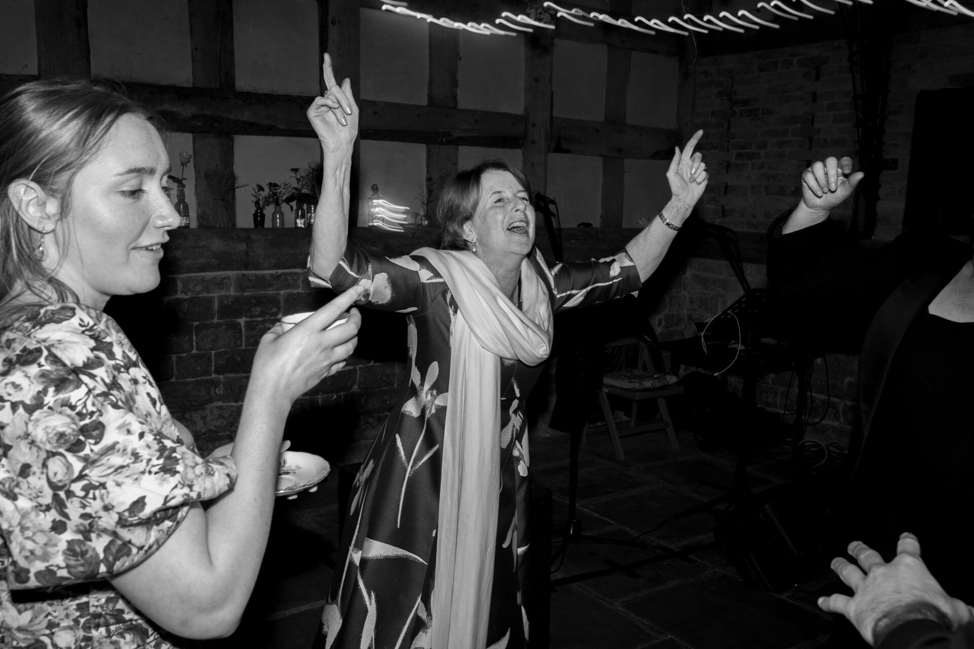 Wedding guests enjoy the party at the Wool Barn, Gloucestershire wedding venue