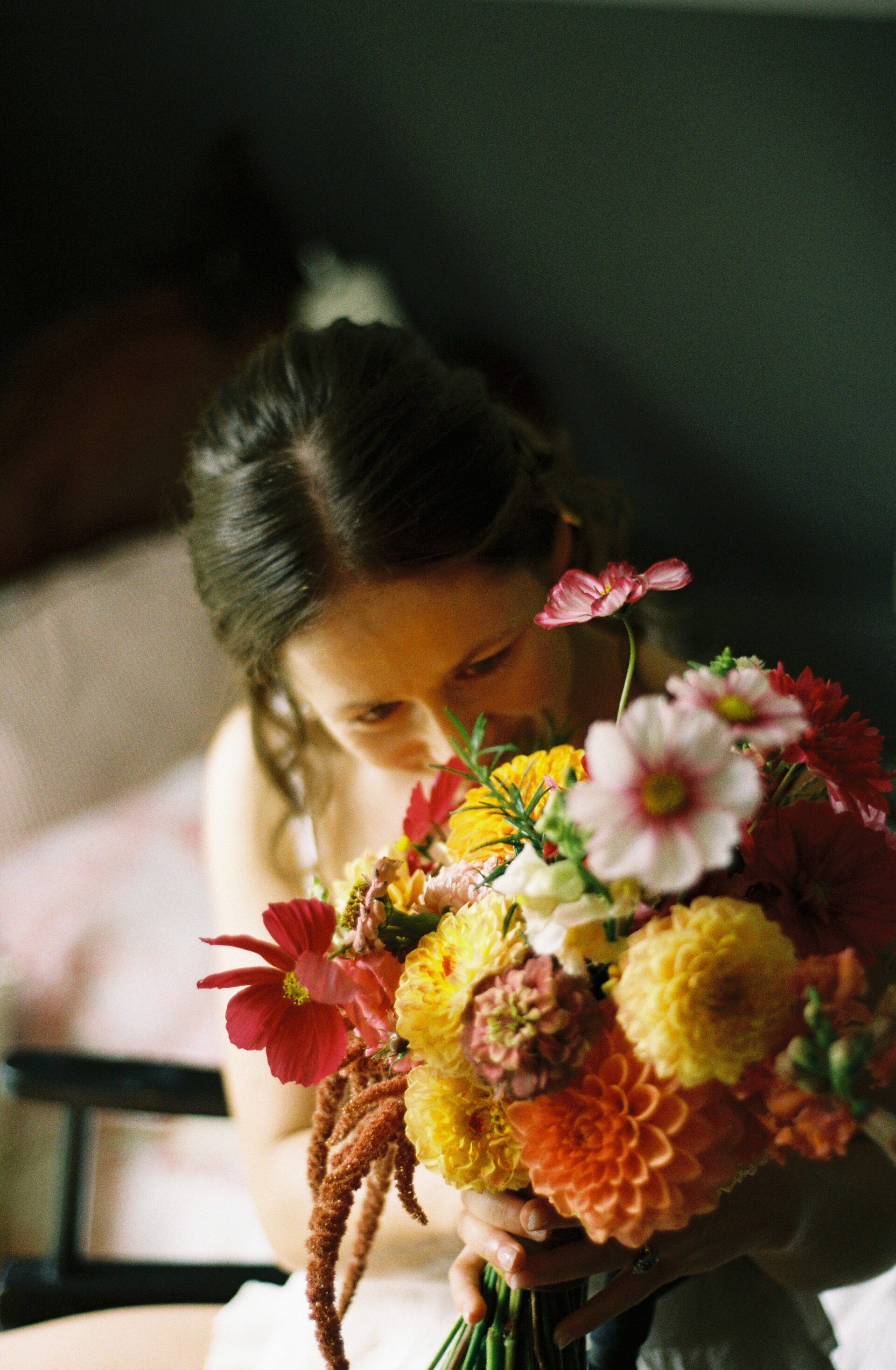 The bride inspects her wedding flowers