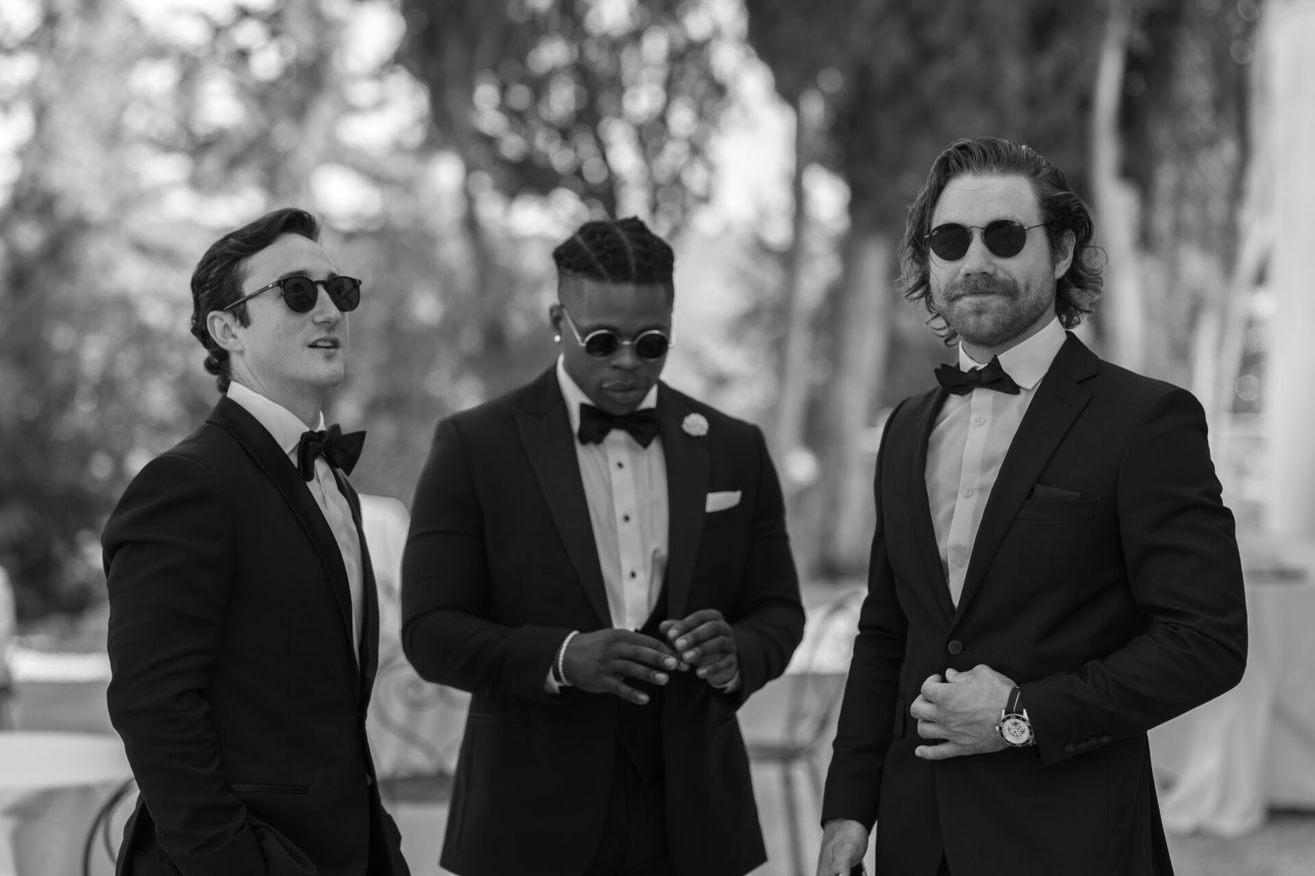 Italian wedding photography captures groomsmen candid in Tuscany