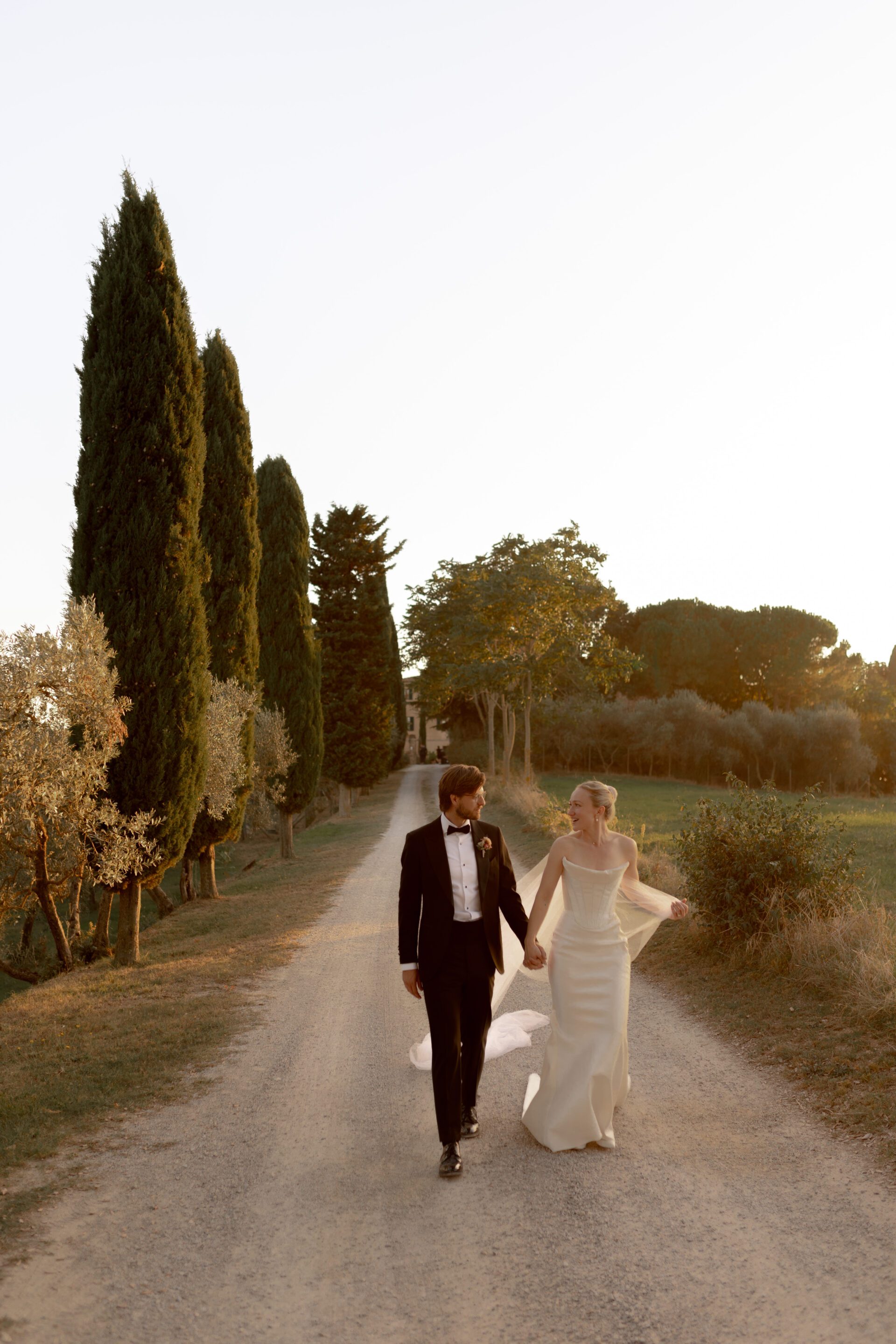 Destination wedding photographer captures couple portraits during golden hour at Italian wedding