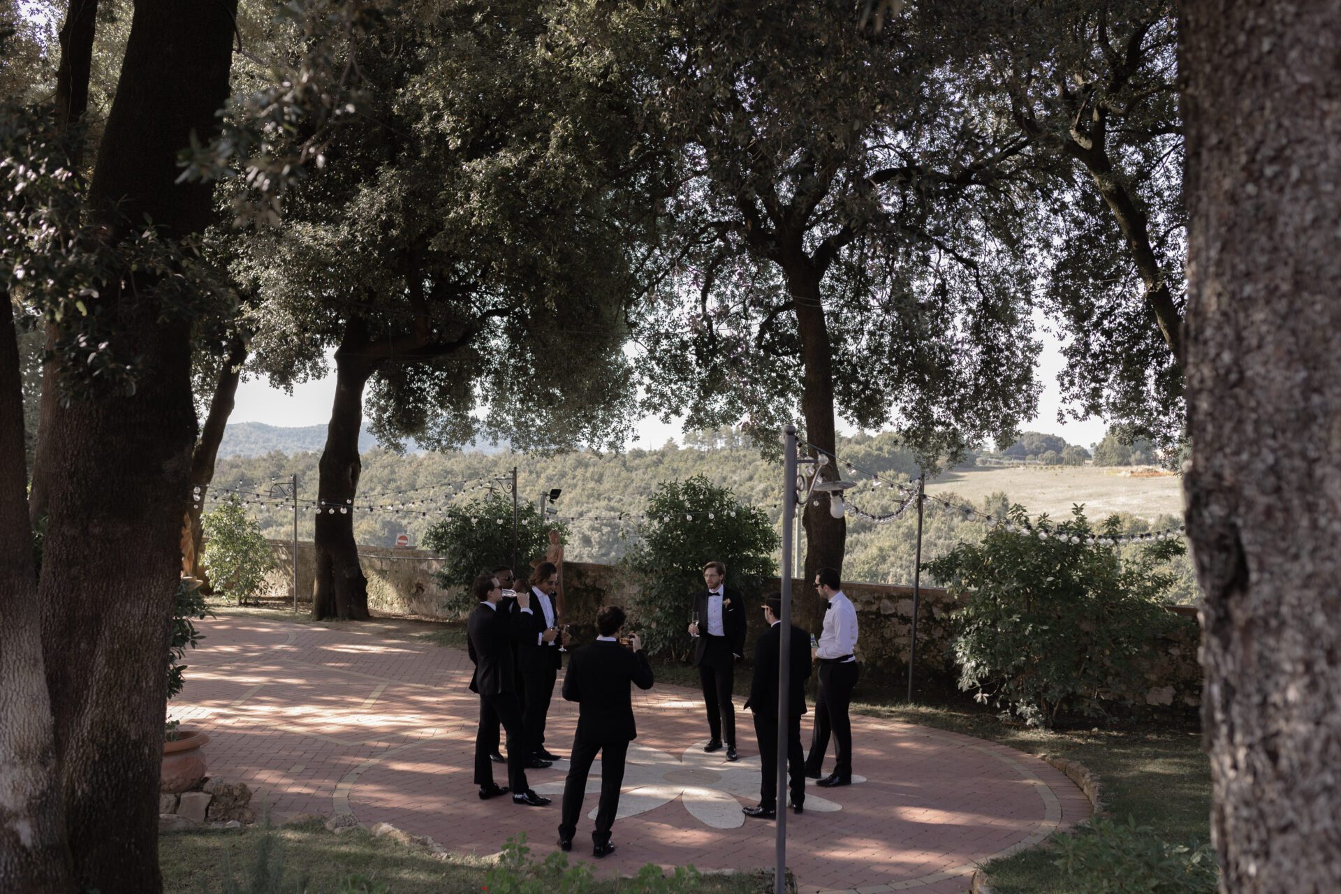 The groom spends time with his groomsmen at his Italian wedding venue