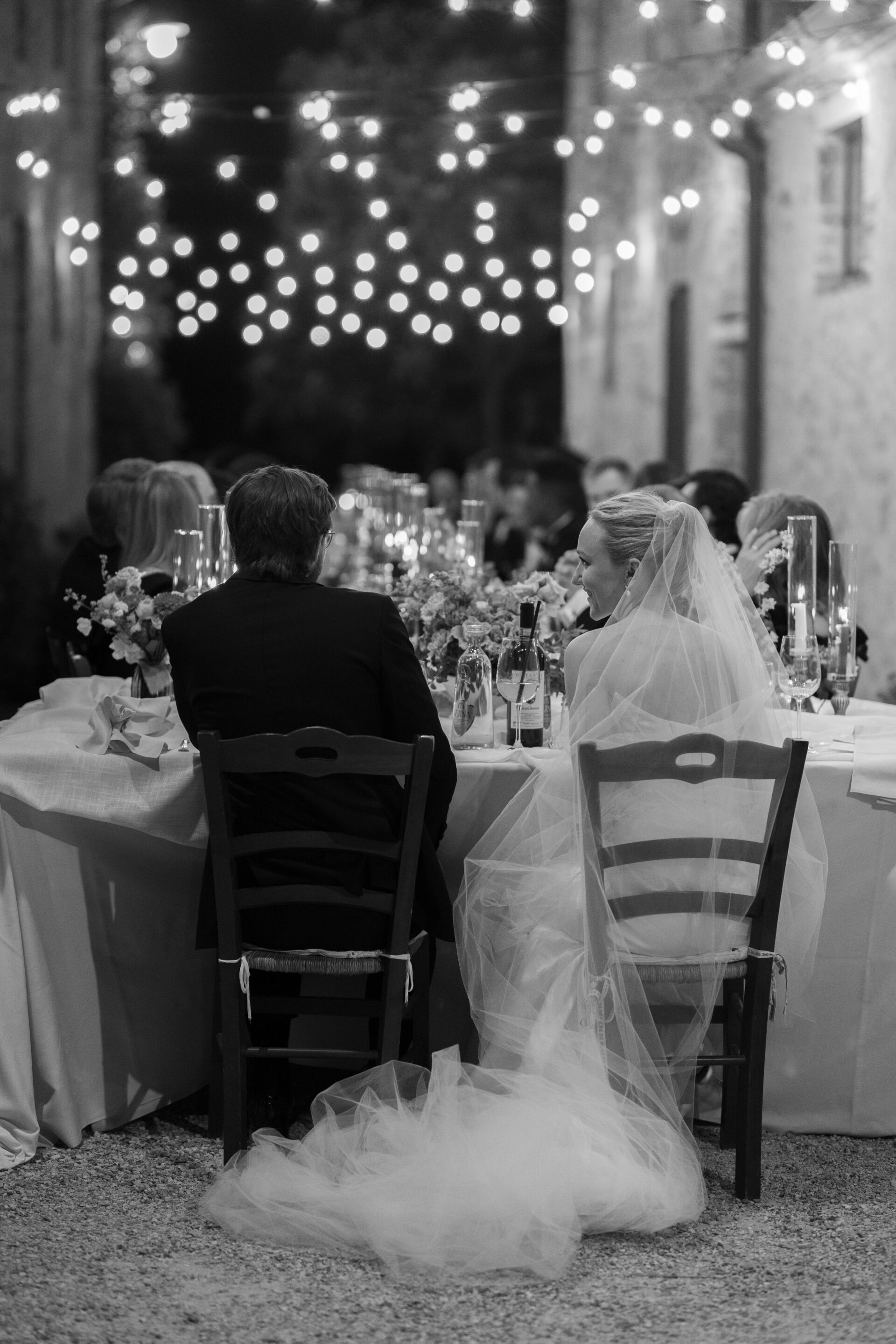 Guests enjoy an Italian wedding feast at luxury Tuscan wedding