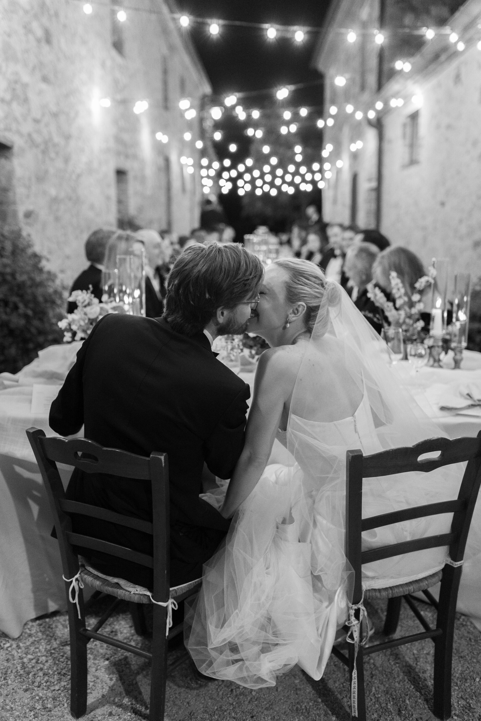 The bride and groom share a kiss at their Italian wedding