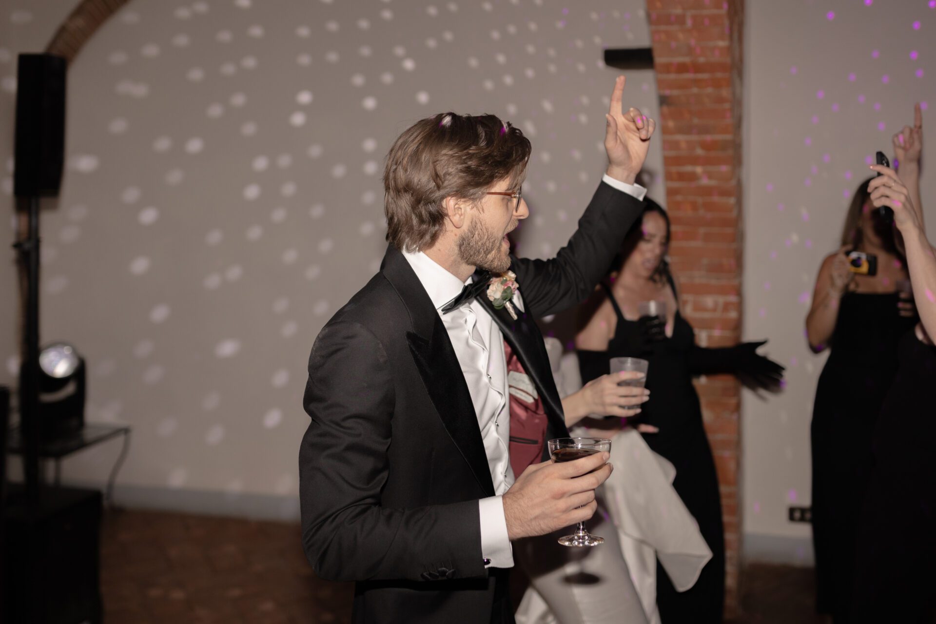The groom enjoys the afterparty at his luxury Italian wedding