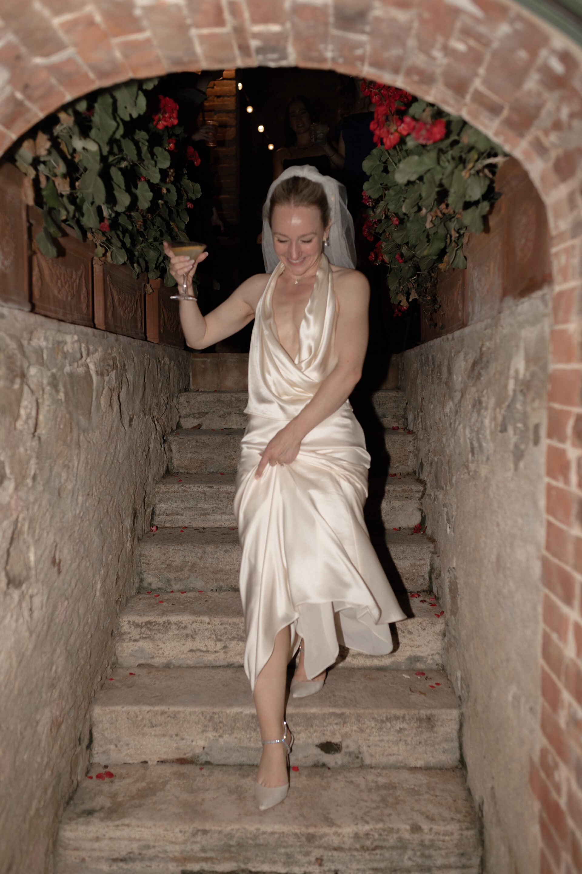 The bride changes outfits for her luxury Italian wedding afterparty